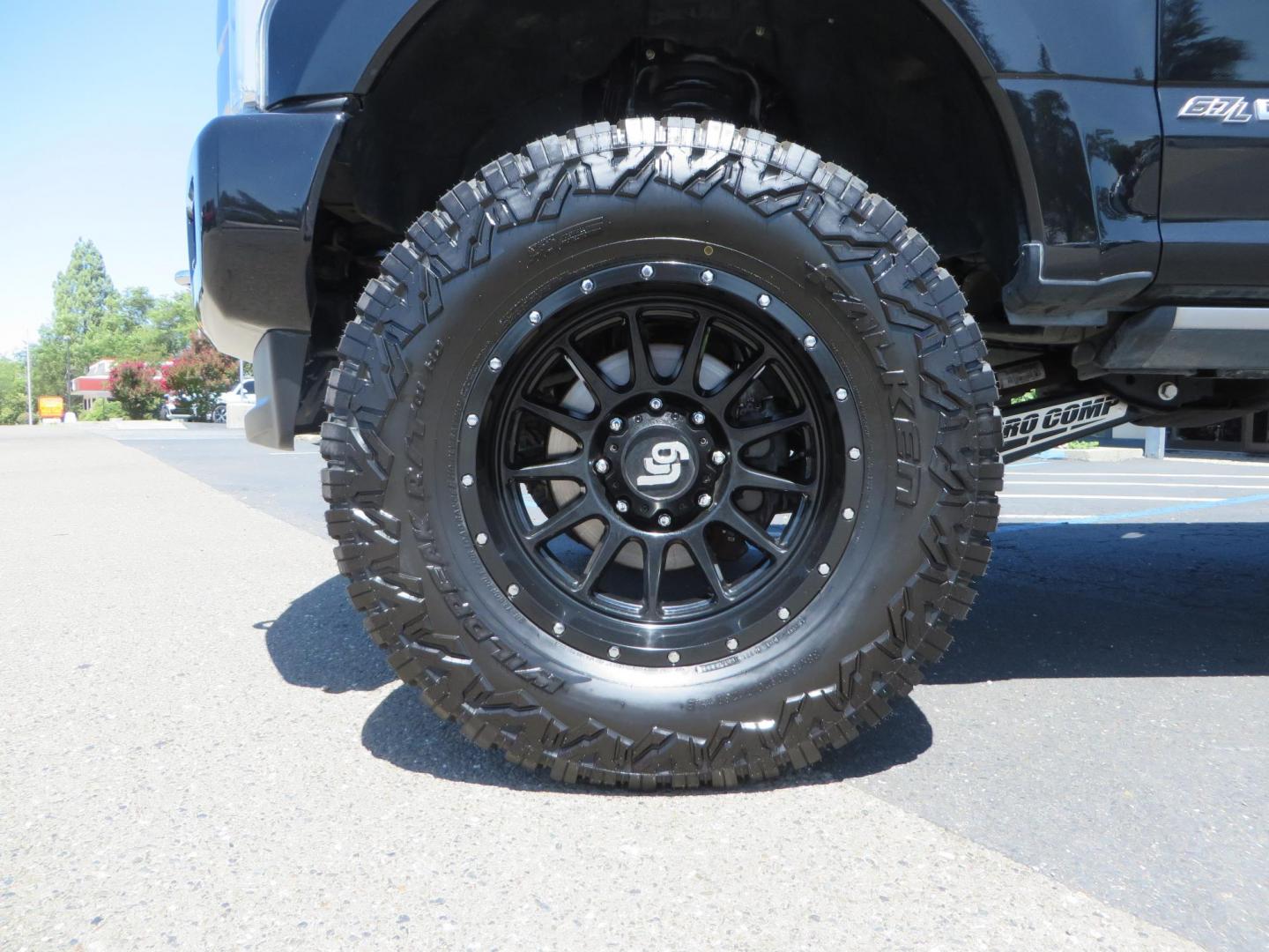 2019 BLACK Ford F-250 SD Platinum Crew Cab Short Bed 4WD (1FT7W2BTXKE) with an 6.7L V8 OHV 16V DIESEL engine, 6A transmission, located at 2630 Grass Valley Highway, Auburn, CA, 95603, (530) 508-5100, 38.937893, -121.095482 - Featuring a 6" Pro Comp Suspension system, Fox shocks and dual steering stabilizers, 38" Falken Wildpeak tires, 20" LRG wheels, Window tint, and painted Ford badges. - Photo#7