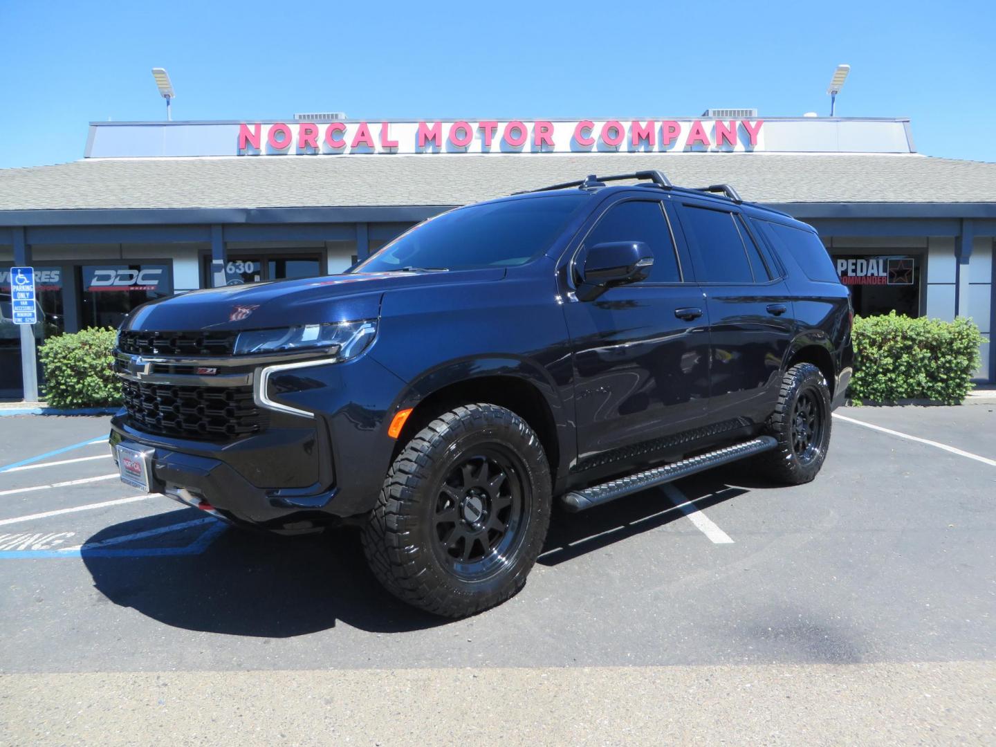 2021 Blue /Black Chevrolet Tahoe Z71 (1GNSKPKD4MR) with an 5.3L V8 OHV 16V engine, automatic transmission, located at 2630 Grass Valley Highway, Auburn, CA, 95603, (530) 508-5100, 38.937893, -121.095482 - Z71 Tahoe with Method Race Wheels, Nitto Ridge Grappler tires, Window tint, and roof mounted crossbars. DVD screen that is missing in pictures has been replaced. - Photo#0