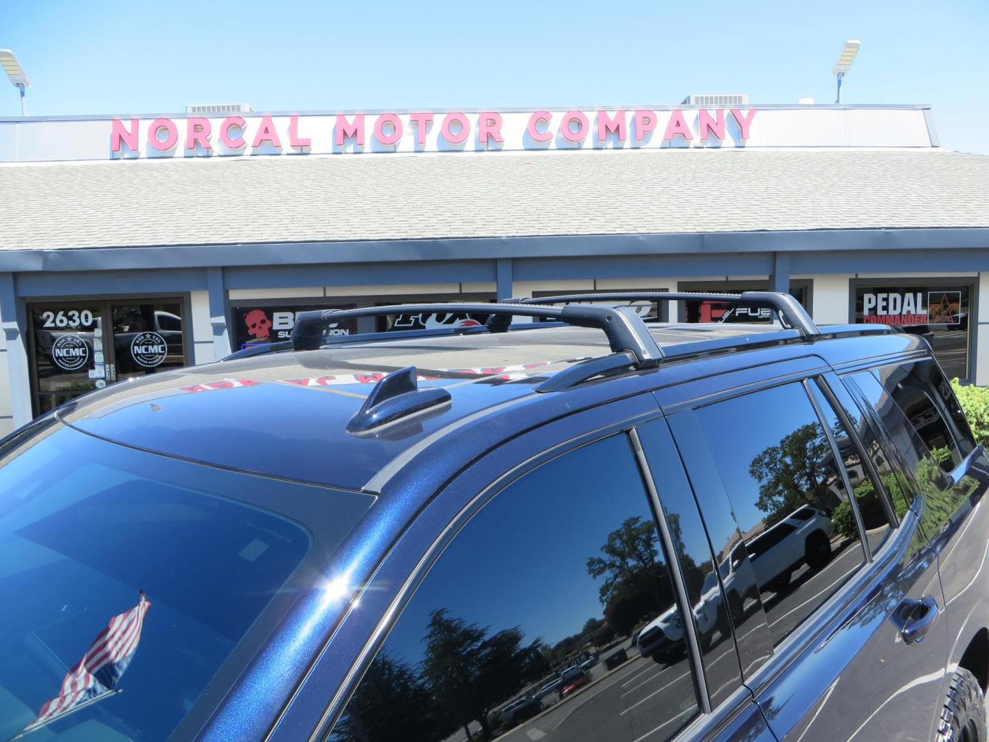 2021 Blue /Black Chevrolet Tahoe Z71 (1GNSKPKD4MR) with an 5.3L V8 OHV 16V engine, automatic transmission, located at 2630 Grass Valley Highway, Auburn, CA, 95603, (530) 508-5100, 38.937893, -121.095482 - Z71 Tahoe with Method Race Wheels, Nitto Ridge Grappler tires, Window tint, and roof mounted crossbars. DVD screen that is missing in pictures has been replaced. - Photo#10