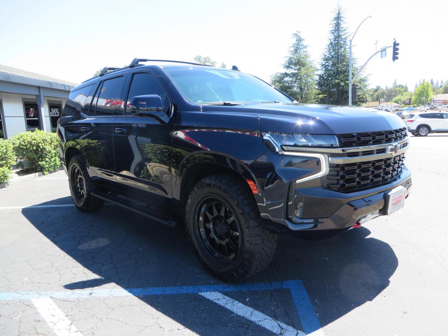 2021 Blue /Black Chevrolet Tahoe Z71 (1GNSKPKD4MR) with an 5.3L V8 OHV 16V engine, automatic transmission, located at 2630 Grass Valley Highway, Auburn, CA, 95603, (530) 508-5100, 38.937893, -121.095482 - Z71 Tahoe with Method Race Wheels, Nitto Ridge Grappler tires, Window tint, and roof mounted crossbars. DVD screen that is missing in pictures has been replaced. - Photo#1