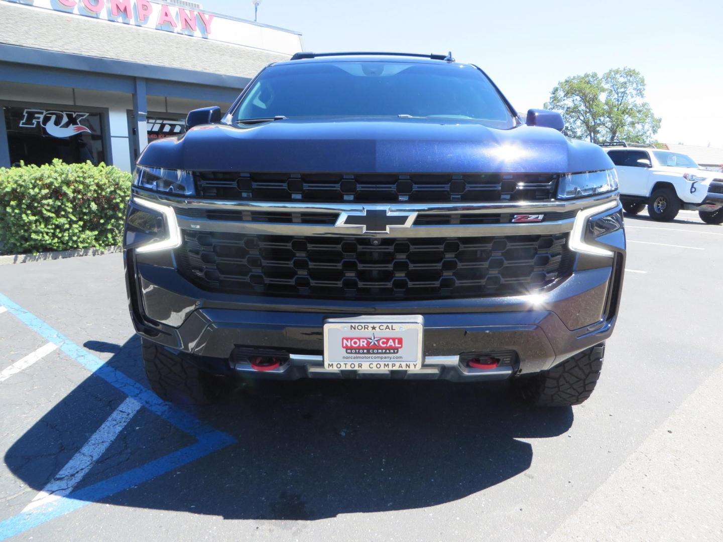 2021 Blue /Black Chevrolet Tahoe Z71 (1GNSKPKD4MR) with an 5.3L V8 OHV 16V engine, automatic transmission, located at 2630 Grass Valley Highway, Auburn, CA, 95603, (530) 508-5100, 38.937893, -121.095482 - Z71 Tahoe with Method Race Wheels, Nitto Ridge Grappler tires, Window tint, and roof mounted crossbars. DVD screen that is missing in pictures has been replaced. - Photo#2