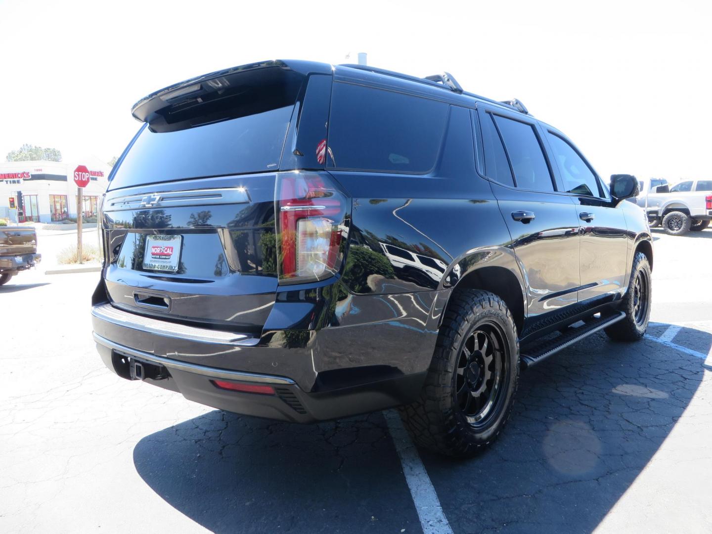 2021 Blue /Black Chevrolet Tahoe Z71 (1GNSKPKD4MR) with an 5.3L V8 OHV 16V engine, automatic transmission, located at 2630 Grass Valley Highway, Auburn, CA, 95603, (530) 508-5100, 38.937893, -121.095482 - Z71 Tahoe with Method Race Wheels, Nitto Ridge Grappler tires, Window tint, and roof mounted crossbars. DVD screen that is missing in pictures has been replaced. - Photo#4