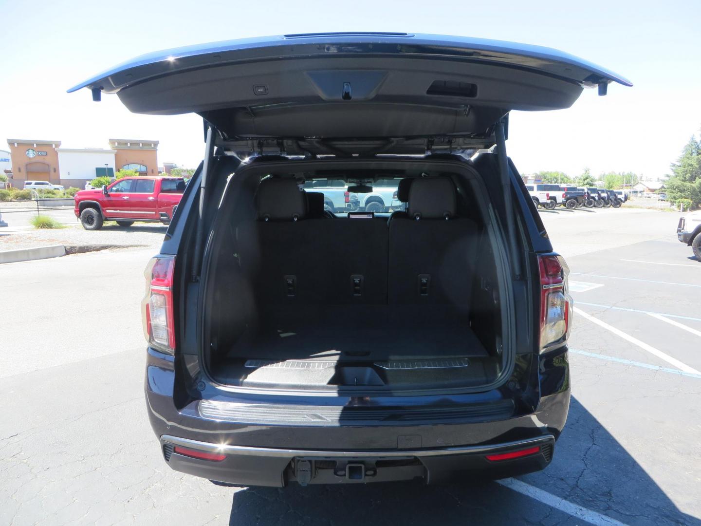 2021 Blue /Black Chevrolet Tahoe Z71 (1GNSKPKD4MR) with an 5.3L V8 OHV 16V engine, automatic transmission, located at 2630 Grass Valley Highway, Auburn, CA, 95603, (530) 508-5100, 38.937893, -121.095482 - Z71 Tahoe with Method Race Wheels, Nitto Ridge Grappler tires, Window tint, and roof mounted crossbars. DVD screen that is missing in pictures has been replaced. - Photo#58