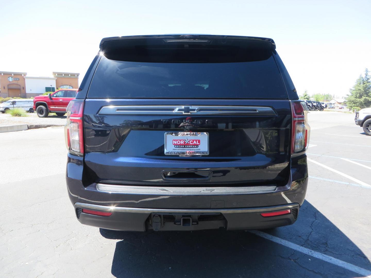 2021 Blue /Black Chevrolet Tahoe Z71 (1GNSKPKD4MR) with an 5.3L V8 OHV 16V engine, automatic transmission, located at 2630 Grass Valley Highway, Auburn, CA, 95603, (530) 508-5100, 38.937893, -121.095482 - Z71 Tahoe with Method Race Wheels, Nitto Ridge Grappler tires, Window tint, and roof mounted crossbars. DVD screen that is missing in pictures has been replaced. - Photo#5