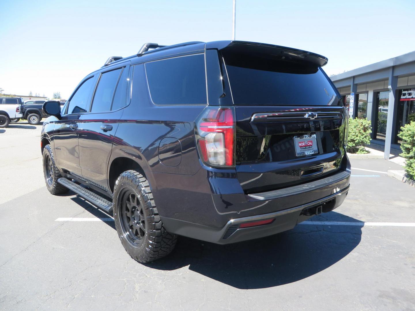 2021 Blue /Black Chevrolet Tahoe Z71 (1GNSKPKD4MR) with an 5.3L V8 OHV 16V engine, automatic transmission, located at 2630 Grass Valley Highway, Auburn, CA, 95603, (530) 508-5100, 38.937893, -121.095482 - Z71 Tahoe with Method Race Wheels, Nitto Ridge Grappler tires, Window tint, and roof mounted crossbars. DVD screen that is missing in pictures has been replaced. - Photo#6