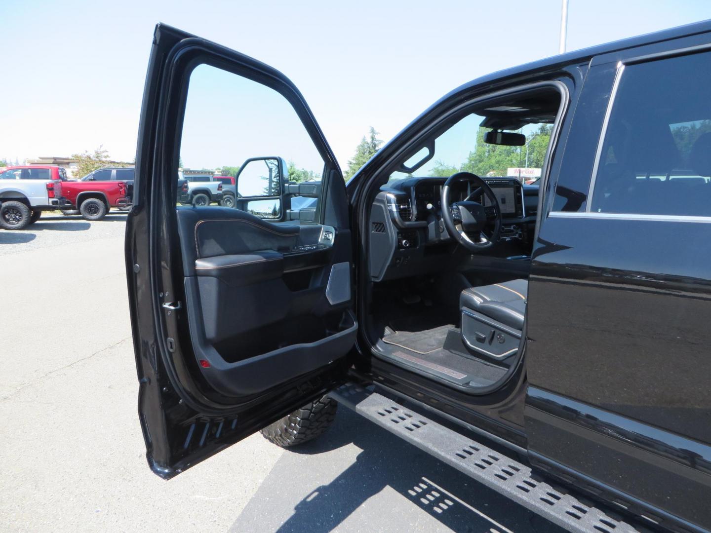 2023 Ford F-350 SD Platinum Crew Cab Short Bed 4WD (1FT8W3BM7PE) with an 6.7L V8 OHV 16V DIESEL engine, 6A transmission, located at 2630 Grass Valley Highway, Auburn, CA, 95603, (530) 508-5100, 38.937893, -121.095482 - Features a BDS 3" radius arm suspension system, Fox 2.0 Shocks, 17" KMC Beadlock wheels with Powdercoated black rings and ARP hardware, 37" Toyo RT trail tires, and a factory slim line bug deflector. - Photo#27