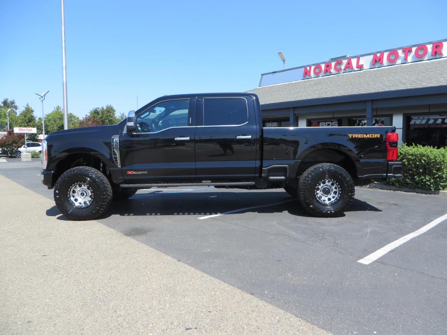 2023 Ford F-350 SD Platinum Crew Cab Short Bed 4WD (1FT8W3BM7PE) with an 6.7L V8 OHV 16V DIESEL engine, 6A transmission, located at 2630 Grass Valley Highway, Auburn, CA, 95603, (530) 508-5100, 38.937893, -121.095482 - Features a BDS 3" radius arm suspension system, Fox 2.0 Shocks, 17" KMC Beadlock wheels with Powdercoated black rings and ARP hardware, 37" Toyo RT trail tires, and a factory slim line bug deflector. - Photo#7