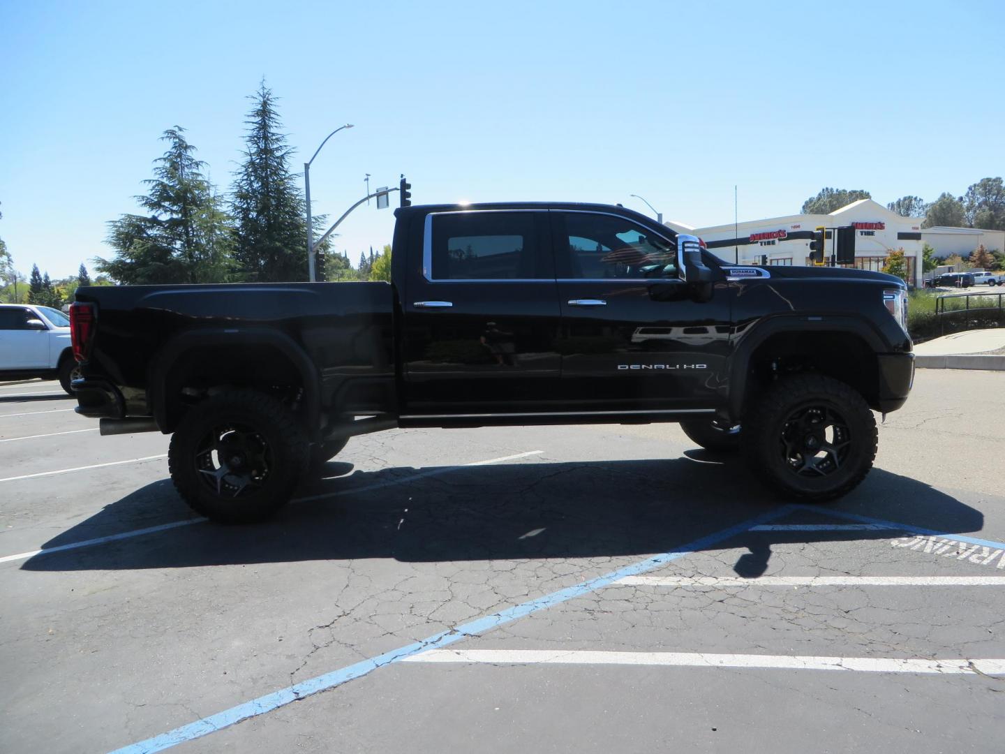 2023 /BLACK GMC Sierra 2500HD Denali Crew Cab 4WD SB (1GT49REY5PF) with an 6.6L V8 OHV 16V TURBO DIESEL engine, 6A transmission, located at 2630 Grass Valley Highway, Auburn, CA, 95603, (530) 508-5100, 38.937893, -121.095482 - Denali 2500 sitting on a BDS 5" suspension system, Upper control arms, Fox shocks, 20" 4 Play wheels, 37" Nitto Ridge Grappler tires, window tint, and weathertech floor liners. - Photo#3