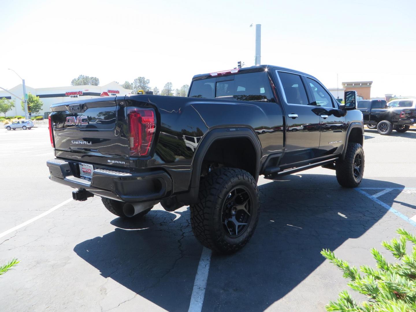 2023 /BLACK GMC Sierra 2500HD Denali Crew Cab 4WD SB (1GT49REY5PF) with an 6.6L V8 OHV 16V TURBO DIESEL engine, 6A transmission, located at 2630 Grass Valley Highway, Auburn, CA, 95603, (530) 508-5100, 38.937893, -121.095482 - Denali 2500 sitting on a BDS 5" suspension system, Upper control arms, Fox shocks, 20" 4 Play wheels, 37" Nitto Ridge Grappler tires, window tint, and weathertech floor liners. - Photo#4