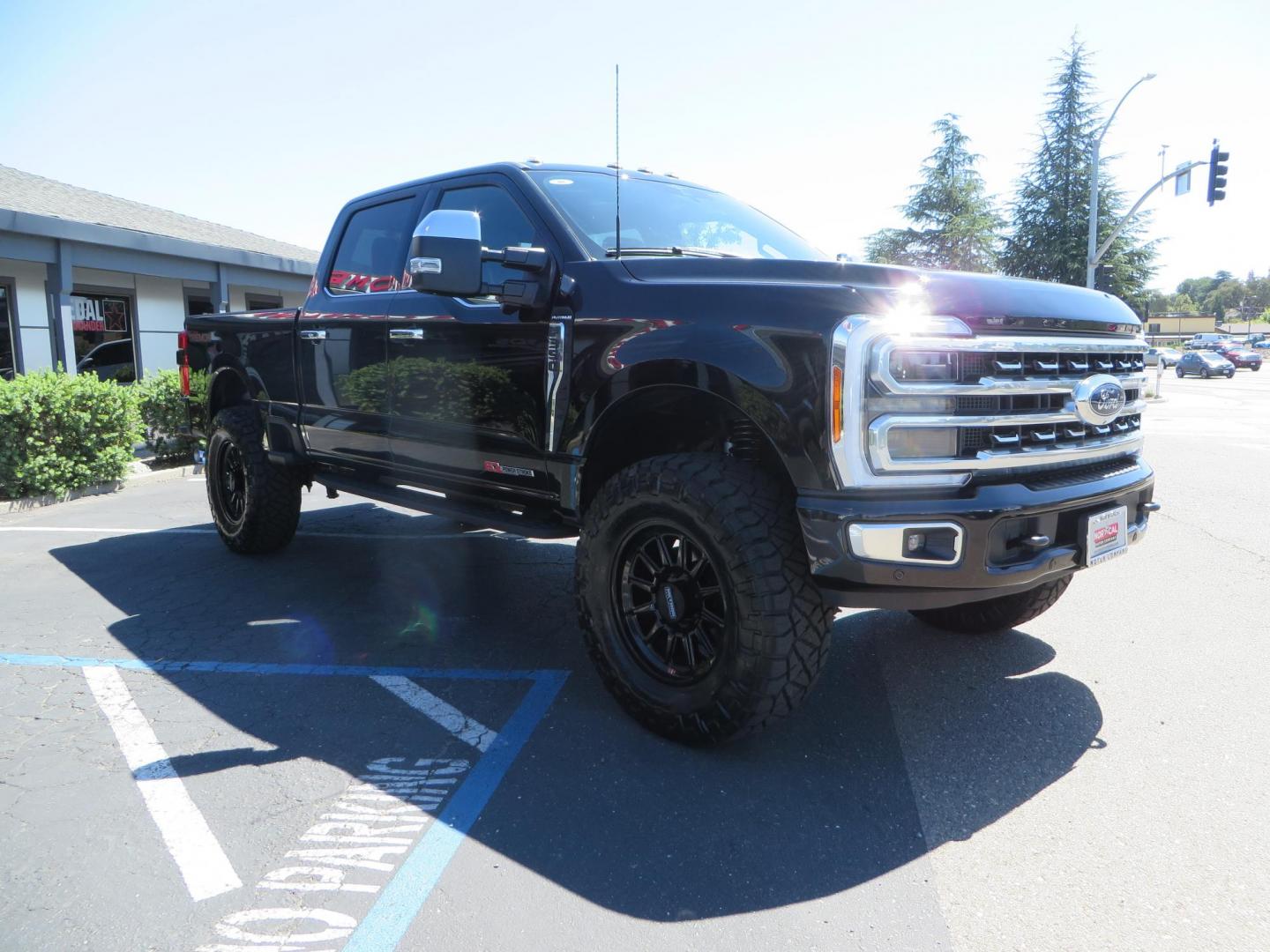 2023 /BLACK Ford F-350 SD Platinum Crew Cab Short Bed 4WD (1FT8W3BM5PE) with an 6.7L V8 OHV 16V DIESEL engine, 6A transmission, located at 2630 Grass Valley Highway, Auburn, CA, 95603, (530) 508-5100, 38.937893, -121.095482 - Features a BDS 3" radius arm suspension system, Fox 2.0 Shocks, 20" Method 323 wheels, 37" Nito Ridge Grappler tires, and a factory slim line bug deflector. - Photo#2