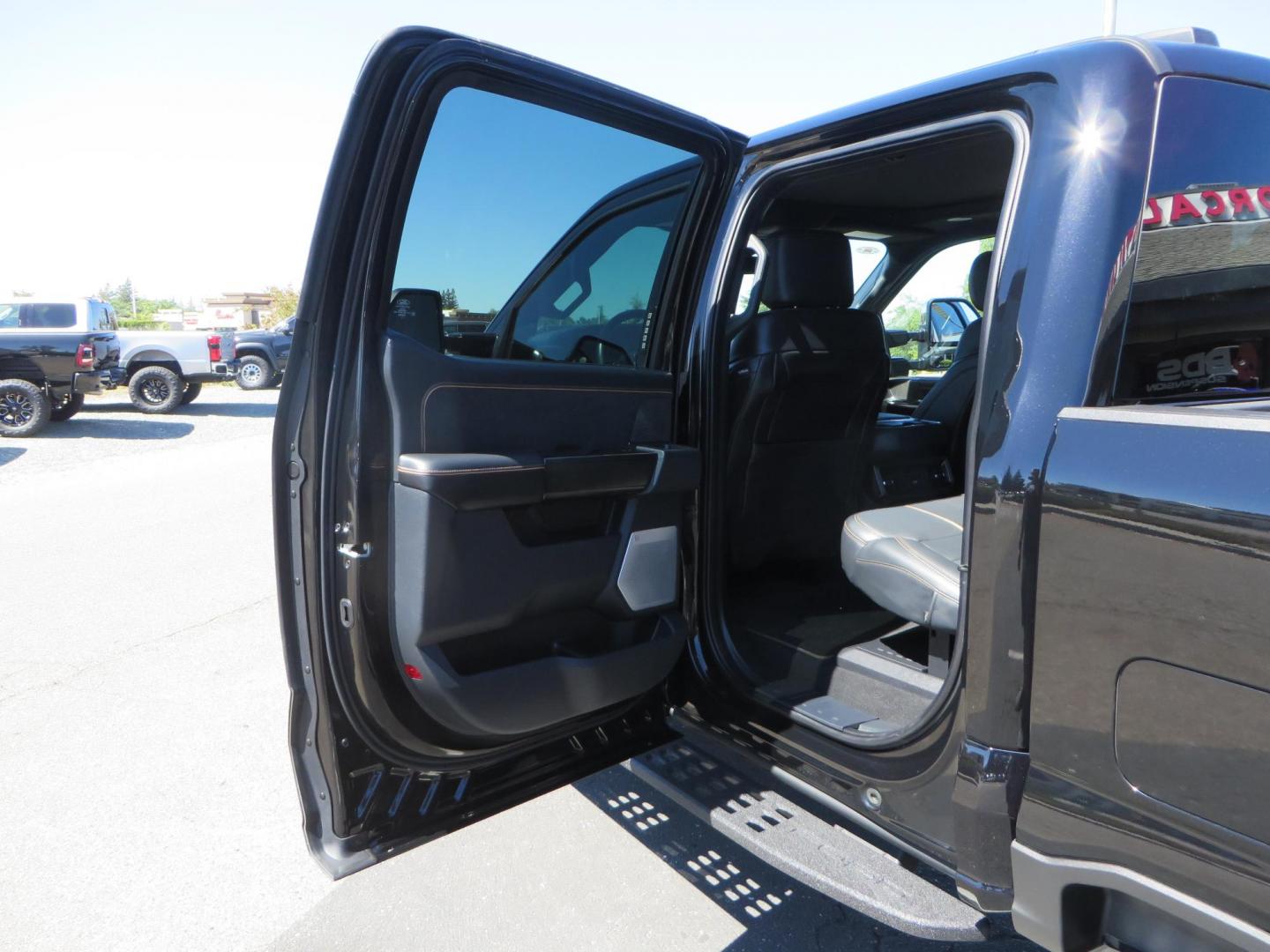 2023 /BLACK Ford F-350 SD Platinum Crew Cab Short Bed 4WD (1FT8W3BM5PE) with an 6.7L V8 OHV 16V DIESEL engine, 6A transmission, located at 2630 Grass Valley Highway, Auburn, CA, 95603, (530) 508-5100, 38.937893, -121.095482 - Features a BDS 3" radius arm suspension system, Fox 2.0 Shocks, 20" Method 323 wheels, 37" Nito Ridge Grappler tires, and a factory slim line bug deflector. - Photo#62