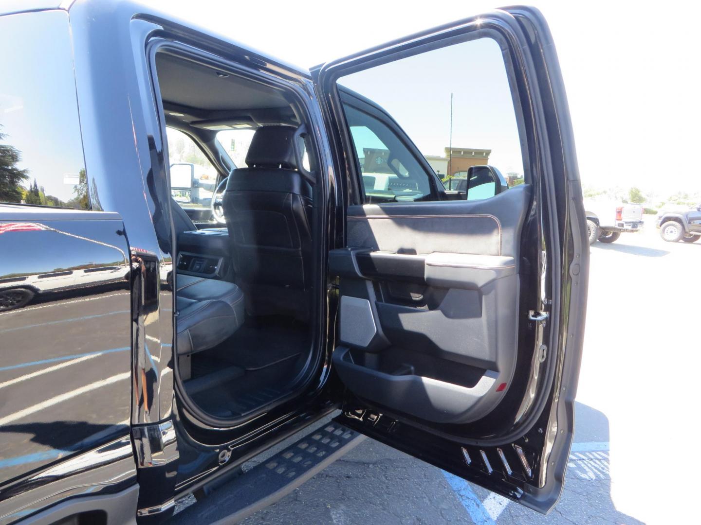 2023 /BLACK Ford F-350 SD Platinum Crew Cab Short Bed 4WD (1FT8W3BM5PE) with an 6.7L V8 OHV 16V DIESEL engine, 6A transmission, located at 2630 Grass Valley Highway, Auburn, CA, 95603, (530) 508-5100, 38.937893, -121.095482 - Features a BDS 3" radius arm suspension system, Fox 2.0 Shocks, 20" Method 323 wheels, 37" Nito Ridge Grappler tires, and a factory slim line bug deflector. - Photo#82