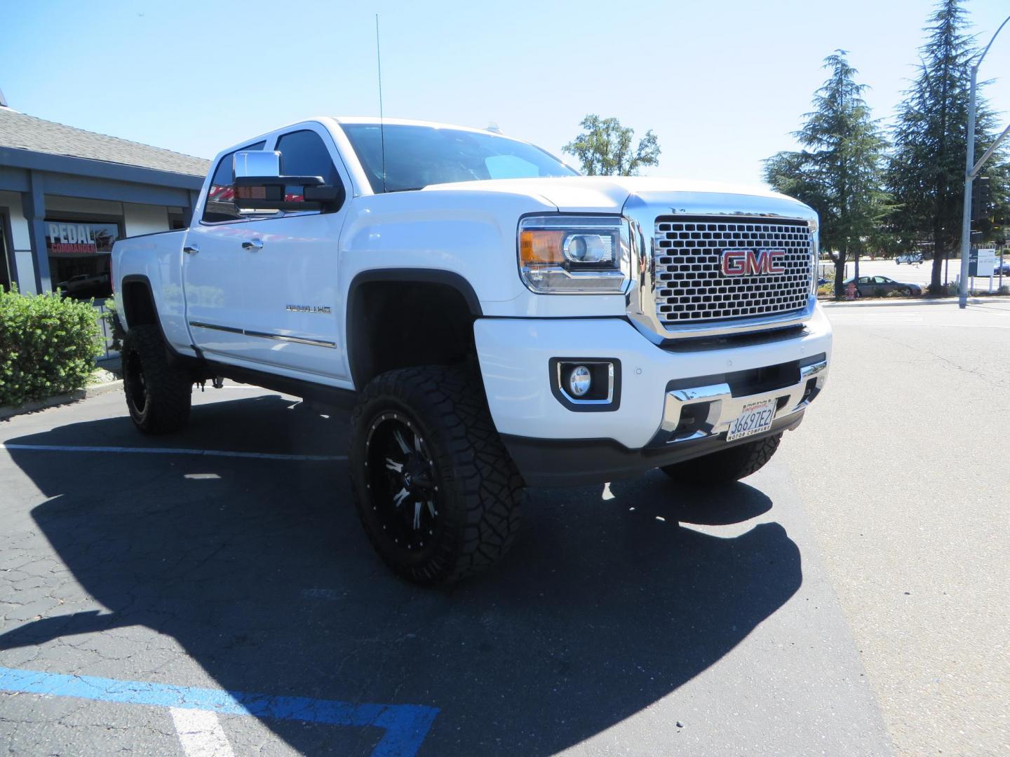 2016 GMC Sierra 2500HD Denali Crew Cab 4WD (1GT12UE8XGF) with an 6.6L V8 OHV 16 DIESEL engine, 6A transmission, located at 2630 Grass Valley Highway, Auburn, CA, 95603, (530) 508-5100, 38.937893, -121.095482 - Lifted Denali 2500 featuring a Pro Comp 6" lift kit, 20" Fuel Nutz wheels, 35" Nitto Ridge Grappler tires, Amp power steps, and Weathertech floor liners. - Photo#2