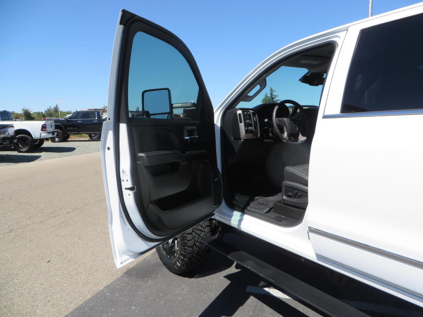 2016 GMC Sierra 2500HD Denali Crew Cab 4WD (1GT12UE8XGF) with an 6.6L V8 OHV 16 DIESEL engine, 6A transmission, located at 2630 Grass Valley Highway, Auburn, CA, 95603, (530) 508-5100, 38.937893, -121.095482 - Lifted Denali 2500 featuring a Pro Comp 6" lift kit, 20" Fuel Nutz wheels, 35" Nitto Ridge Grappler tires, Amp power steps, and Weathertech floor liners. - Photo#19