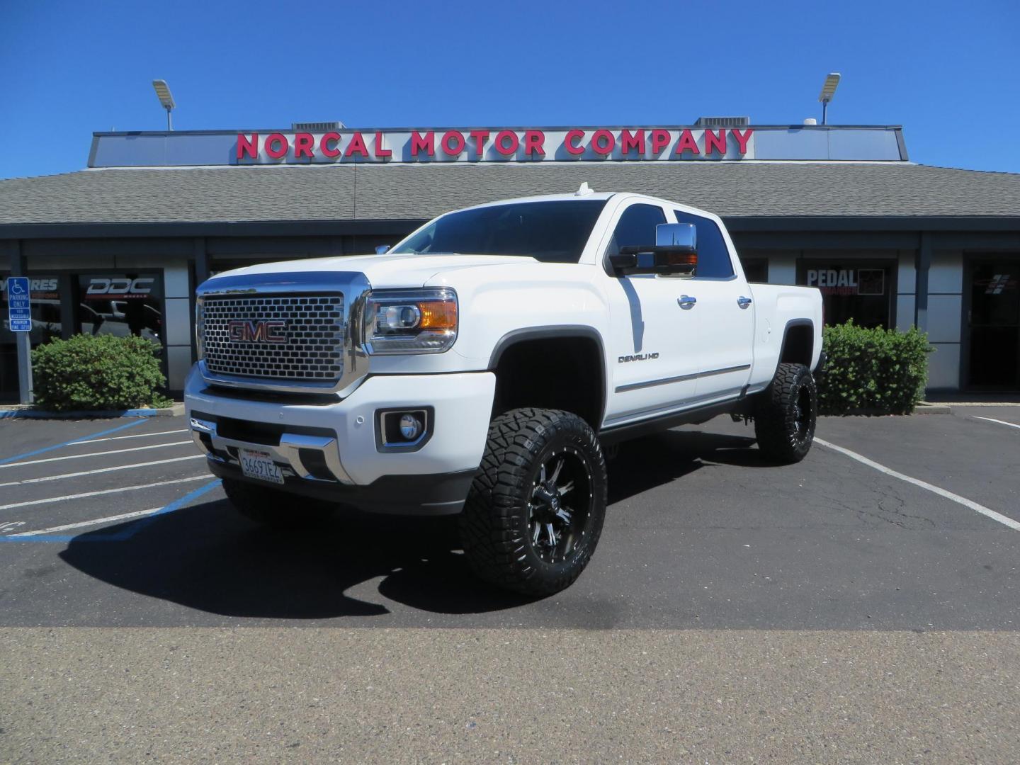 2016 GMC Sierra 2500HD Denali Crew Cab 4WD (1GT12UE8XGF) with an 6.6L V8 OHV 16 DIESEL engine, 6A transmission, located at 2630 Grass Valley Highway, Auburn, CA, 95603, (530) 508-5100, 38.937893, -121.095482 - Lifted Denali 2500 featuring a Pro Comp 6" lift kit, 20" Fuel Nutz wheels, 35" Nitto Ridge Grappler tires, Amp power steps, and Weathertech floor liners. - Photo#0