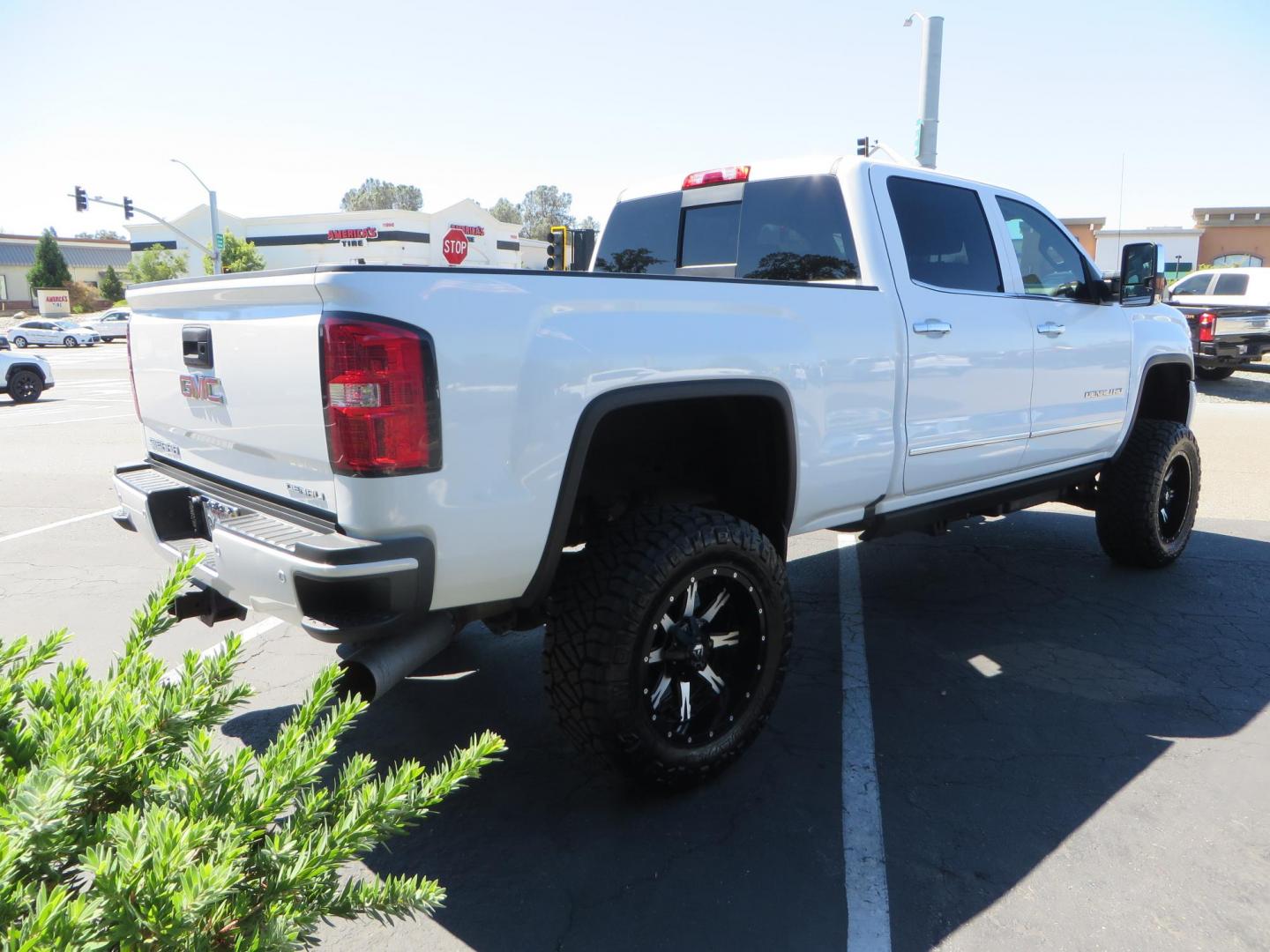 2016 GMC Sierra 2500HD Denali Crew Cab 4WD (1GT12UE8XGF) with an 6.6L V8 OHV 16 DIESEL engine, 6A transmission, located at 2630 Grass Valley Highway, Auburn, CA, 95603, (530) 508-5100, 38.937893, -121.095482 - Lifted Denali 2500 featuring a Pro Comp 6" lift kit, 20" Fuel Nutz wheels, 35" Nitto Ridge Grappler tires, Amp power steps, and Weathertech floor liners. - Photo#3