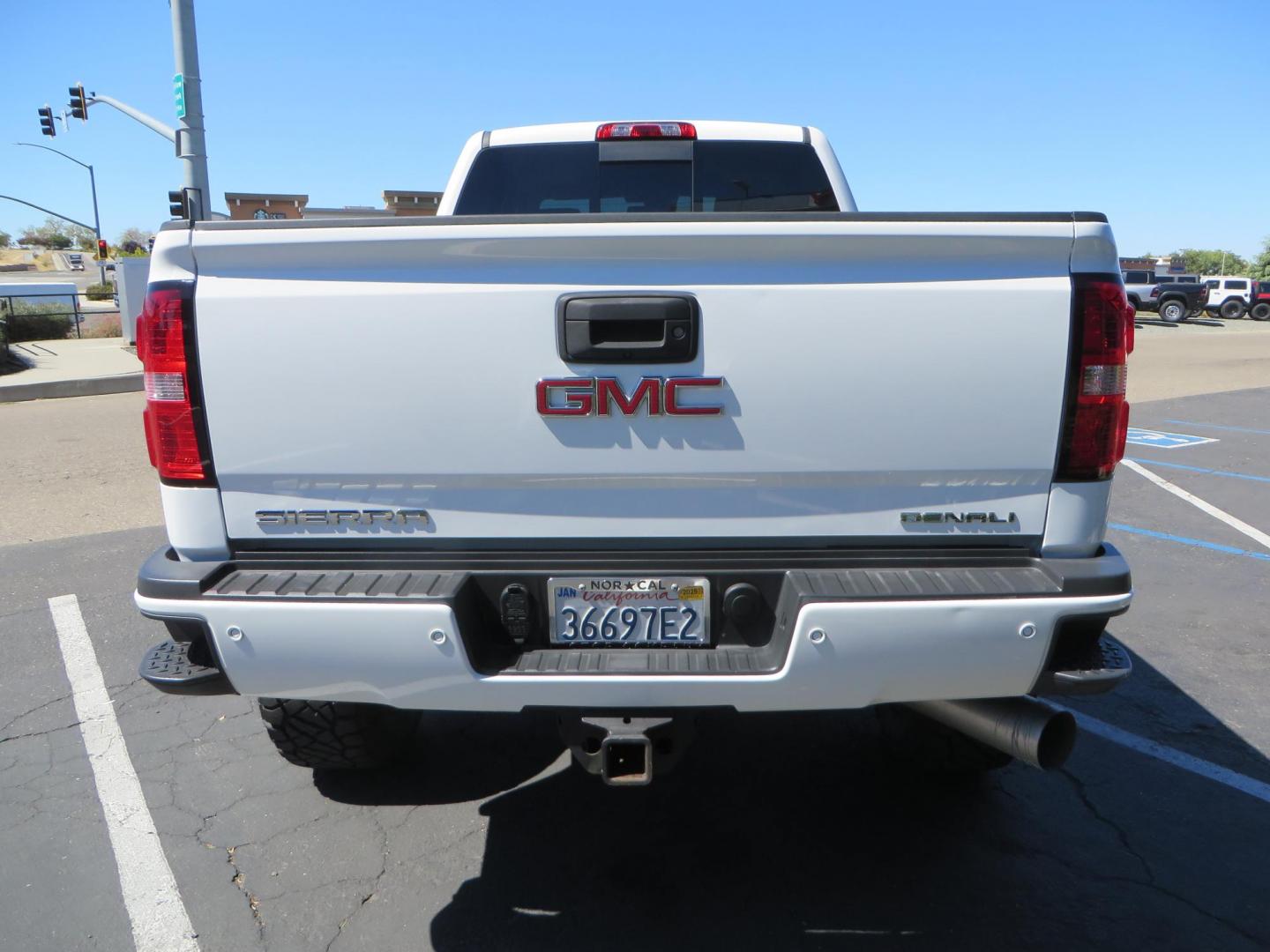 2016 GMC Sierra 2500HD Denali Crew Cab 4WD (1GT12UE8XGF) with an 6.6L V8 OHV 16 DIESEL engine, 6A transmission, located at 2630 Grass Valley Highway, Auburn, CA, 95603, (530) 508-5100, 38.937893, -121.095482 - Lifted Denali 2500 featuring a Pro Comp 6" lift kit, 20" Fuel Nutz wheels, 35" Nitto Ridge Grappler tires, Amp power steps, and Weathertech floor liners. - Photo#6