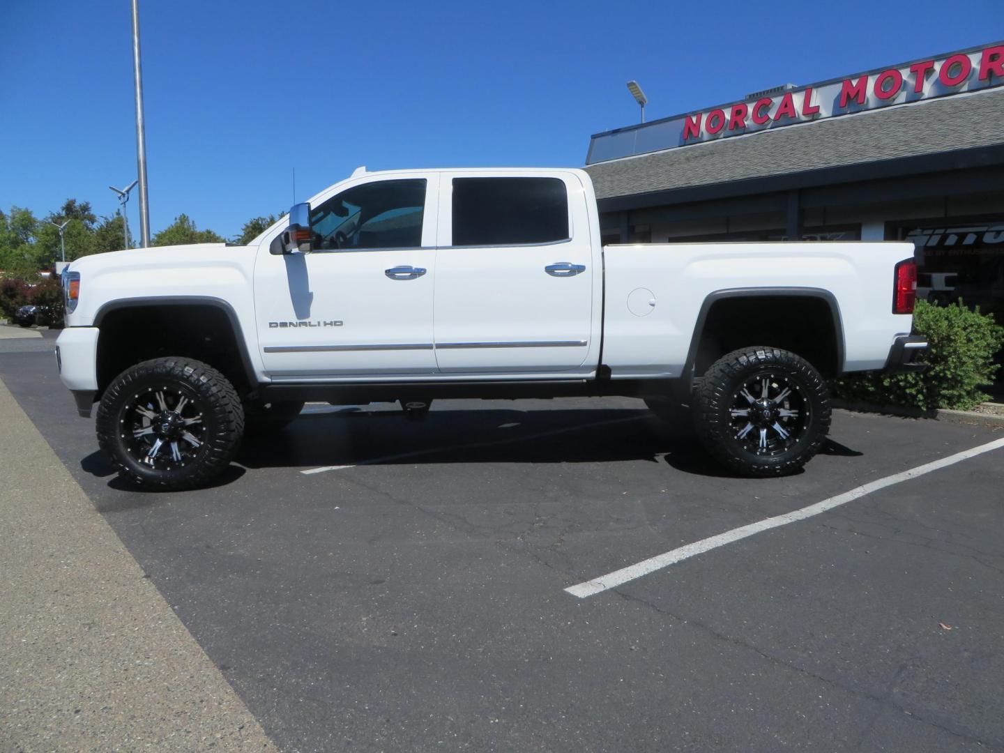 2016 GMC Sierra 2500HD Denali Crew Cab 4WD (1GT12UE8XGF) with an 6.6L V8 OHV 16 DIESEL engine, 6A transmission, located at 2630 Grass Valley Highway, Auburn, CA, 95603, (530) 508-5100, 38.937893, -121.095482 - Lifted Denali 2500 featuring a Pro Comp 6" lift kit, 20" Fuel Nutz wheels, 35" Nitto Ridge Grappler tires, Amp power steps, and Weathertech floor liners. - Photo#8