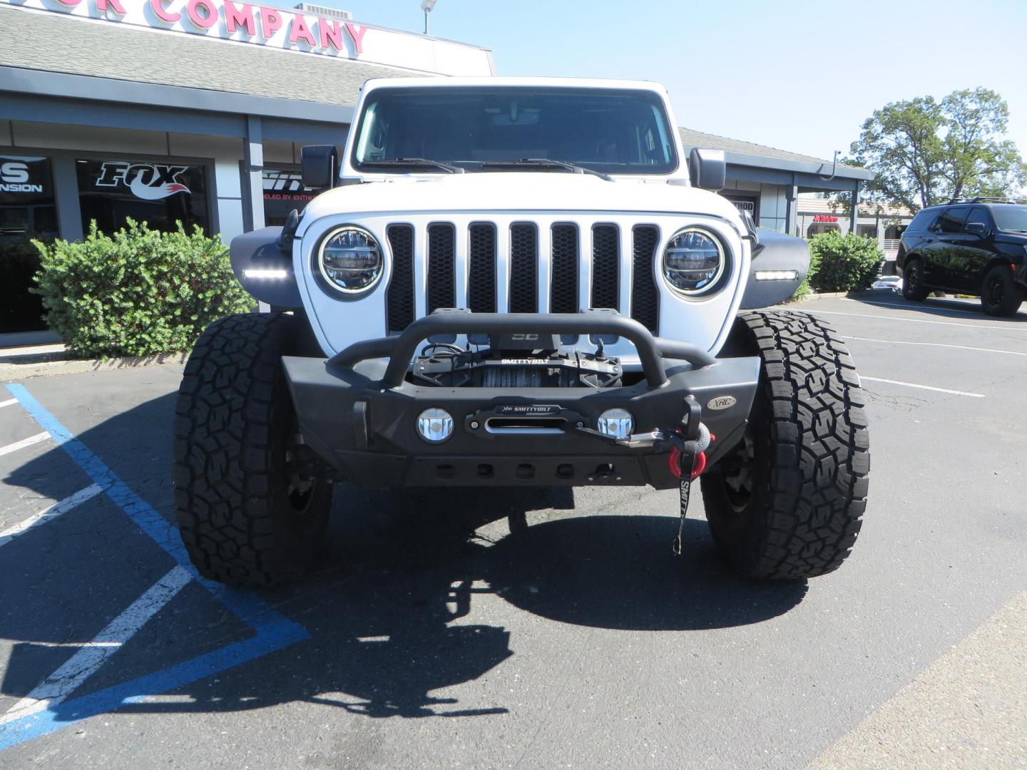 2021 White /BLACK Jeep Wrangler Unlimited Rubicon (1C4HJXFN7MW) with an 2.0L L4 DOHC 16V TURBO engine, 6A transmission, located at 2630 Grass Valley Highway, Auburn, CA, 95603, (530) 508-5100, 38.937893, -121.095482 - Features a Zone Offroad 3" lift kit, Fox Adventure series shocks, 17" Method MR315 wheels, 37" Toyo AT3 tires, Smittybilt XRC front and rear bumpers, Smittybilt Synthetic rope winch, RC inner fender liners, and Barricade front and rear flat fenders. - Photo#2