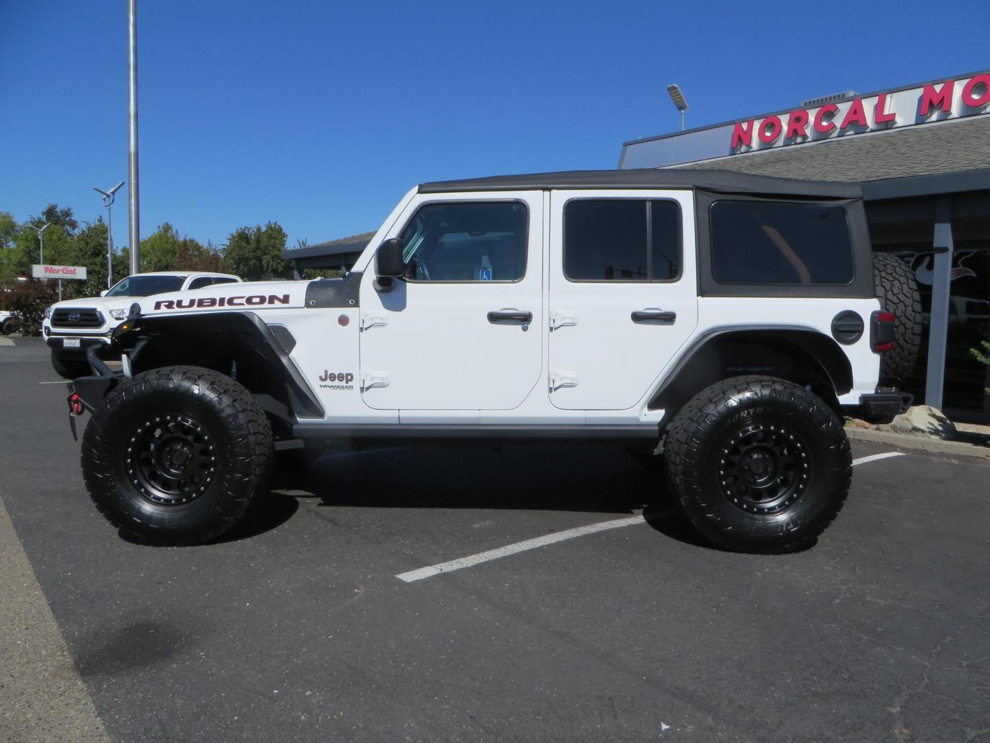 2021 White /BLACK Jeep Wrangler Unlimited Rubicon (1C4HJXFN7MW) with an 2.0L L4 DOHC 16V TURBO engine, 6A transmission, located at 2630 Grass Valley Highway, Auburn, CA, 95603, (530) 508-5100, 38.937893, -121.095482 - Features a Zone Offroad 3" lift kit, Fox Adventure series shocks, 17" Method MR315 wheels, 37" Toyo AT3 tires, Smittybilt XRC front and rear bumpers, Smittybilt Synthetic rope winch, RC inner fender liners, and Barricade front and rear flat fenders. - Photo#7