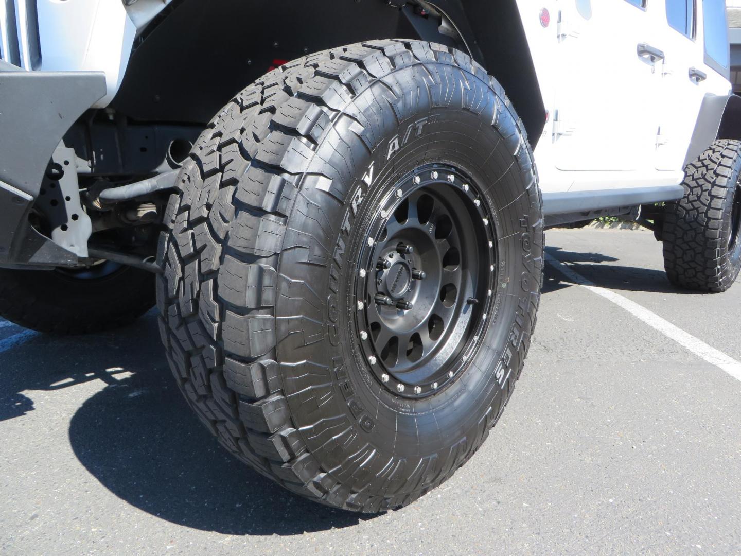 2021 White /BLACK Jeep Wrangler Unlimited Rubicon (1C4HJXFN7MW) with an 2.0L L4 DOHC 16V TURBO engine, 6A transmission, located at 2630 Grass Valley Highway, Auburn, CA, 95603, (530) 508-5100, 38.937893, -121.095482 - Features a Zone Offroad 3" lift kit, Fox Adventure series shocks, 17" Method MR315 wheels, 37" Toyo AT3 tires, Smittybilt XRC front and rear bumpers, Smittybilt Synthetic rope winch, RC inner fender liners, and Barricade front and rear flat fenders. - Photo#8