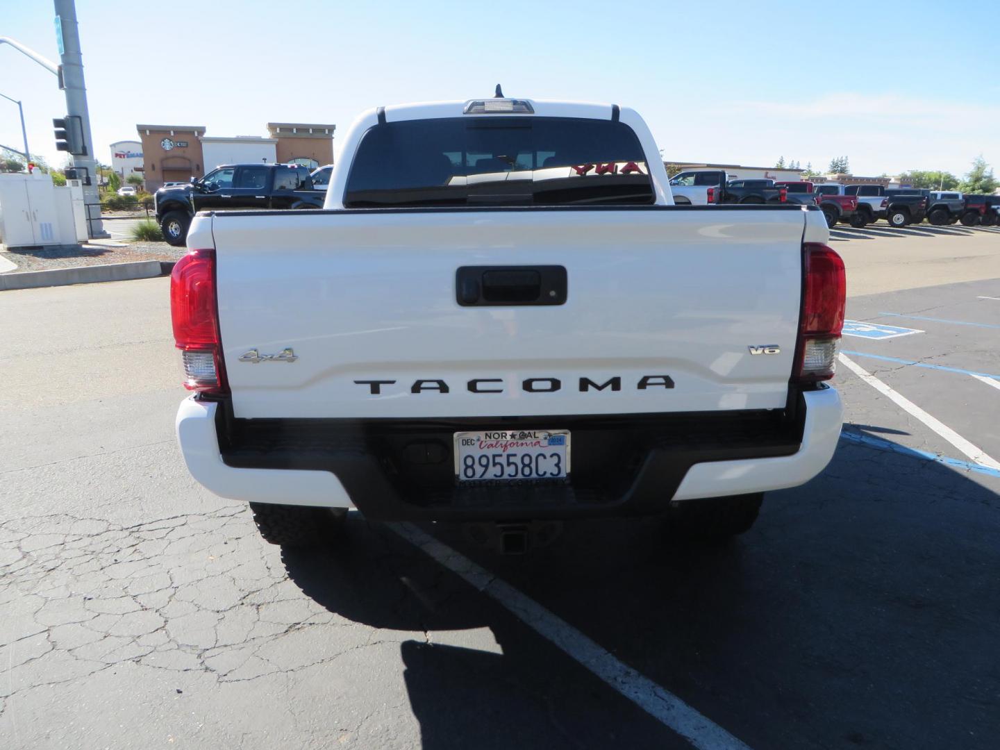 2021 White Toyota Tacoma SR5 Double Cab V6 6AT 4WD (3TMCZ5AN3MM) with an 3.5L V6 DOHC 24V engine, 6A transmission, located at 2630 Grass Valley Highway, Auburn, CA, 95603, (530) 508-5100, 38.937893, -121.095482 - Tacoma SR5 sitting on Bilstein 5100 series front struts and rear shocks, BFG KO2 tires, Method NV wheels, and window tint. - Photo#5