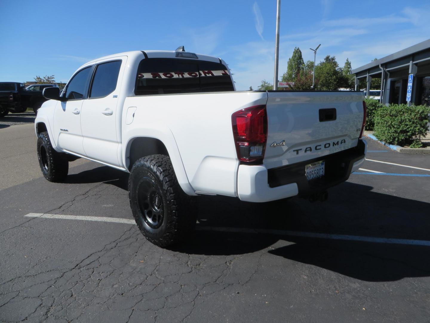 2021 White Toyota Tacoma SR5 Double Cab V6 6AT 4WD (3TMCZ5AN3MM) with an 3.5L V6 DOHC 24V engine, 6A transmission, located at 2630 Grass Valley Highway, Auburn, CA, 95603, (530) 508-5100, 38.937893, -121.095482 - Tacoma SR5 sitting on Bilstein 5100 series front struts and rear shocks, BFG KO2 tires, Method NV wheels, and window tint. - Photo#6