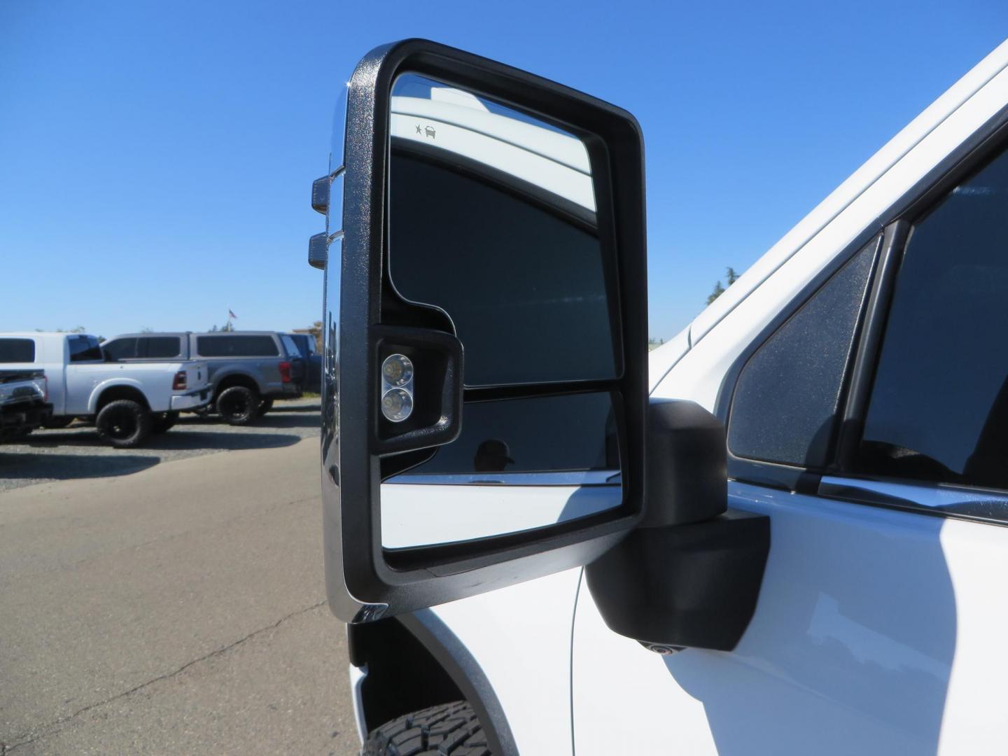 2021 White Chevrolet Silverado 2500HD High Country Crew Cab Short Box 4WD (1GC4YREY9MF) with an 6.6L V8 OHV 16V DIESEL engine, 6A transmission, located at 2630 Grass Valley Highway, Auburn, CA, 95603, (530) 508-5100, 38.937893, -121.095482 - Features - Fabtech leveling kit with upper control arms, 17" Method Race Wheels, 35" Toyo RT trail tires, and window tint. - Photo#27