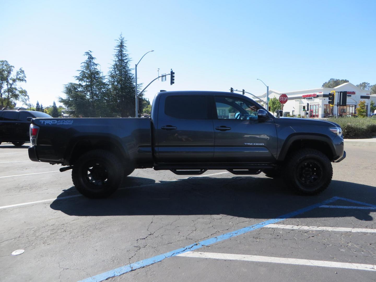 2020 Charcoal /GREY Toyota Tacoma SR5 Double Cab Long Bed V6 6AT 4WD (3TMDZ5BN2LM) with an 3.5L V6 DOHC 24V engine, 6A transmission, located at 2630 Grass Valley Highway, Auburn, CA, 95603, (530) 508-5100, 38.937893, -121.095482 - Tacoma featuring Bilstein 5100 series struts and rear shocks, Icon read add a packs, Method Wheels, Falken Wildpeak AT tires, N-fab runnign boards, Bakflip MX4 bedcover, Molle bed panels, Led Fog lights, and Baja Designs A pillar lights. - Photo#3