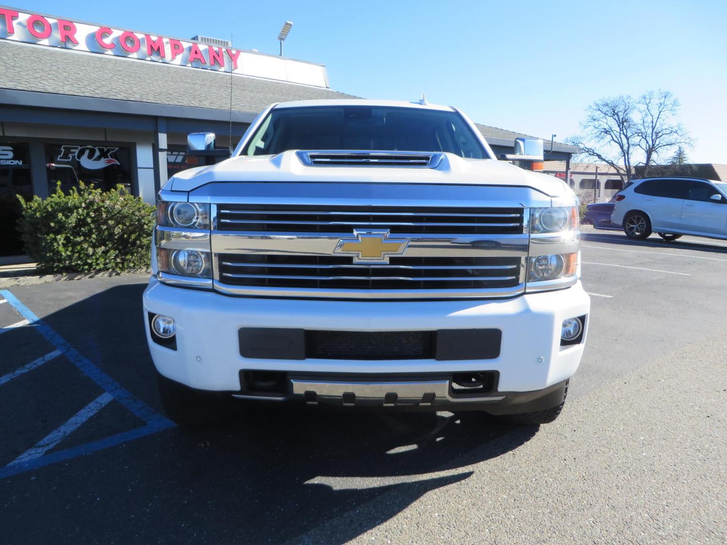 2017 White Chevrolet Silverado 3500HD High Country Crew Cab Short Bed 4WD (1GC4K1EY2HF) with an 6.6L V8 OHV 32V TURBO DIESEL engine, 6A transmission, located at 2630 Grass Valley Highway, Auburn, CA, 95603, (530) 508-5100, 38.937893, -121.095482 - Features 20" Gear Alloy wheels, and Fuel Gripper AT tires. - Photo#1