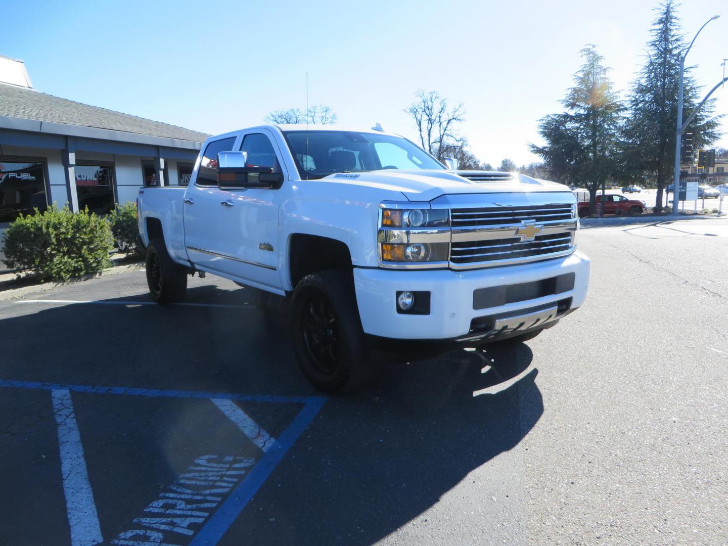 2017 White Chevrolet Silverado 3500HD High Country Crew Cab Short Bed 4WD (1GC4K1EY2HF) with an 6.6L V8 OHV 32V TURBO DIESEL engine, 6A transmission, located at 2630 Grass Valley Highway, Auburn, CA, 95603, (530) 508-5100, 38.937893, -121.095482 - Features 20" Gear Alloy wheels, and Fuel Gripper AT tires. - Photo#2