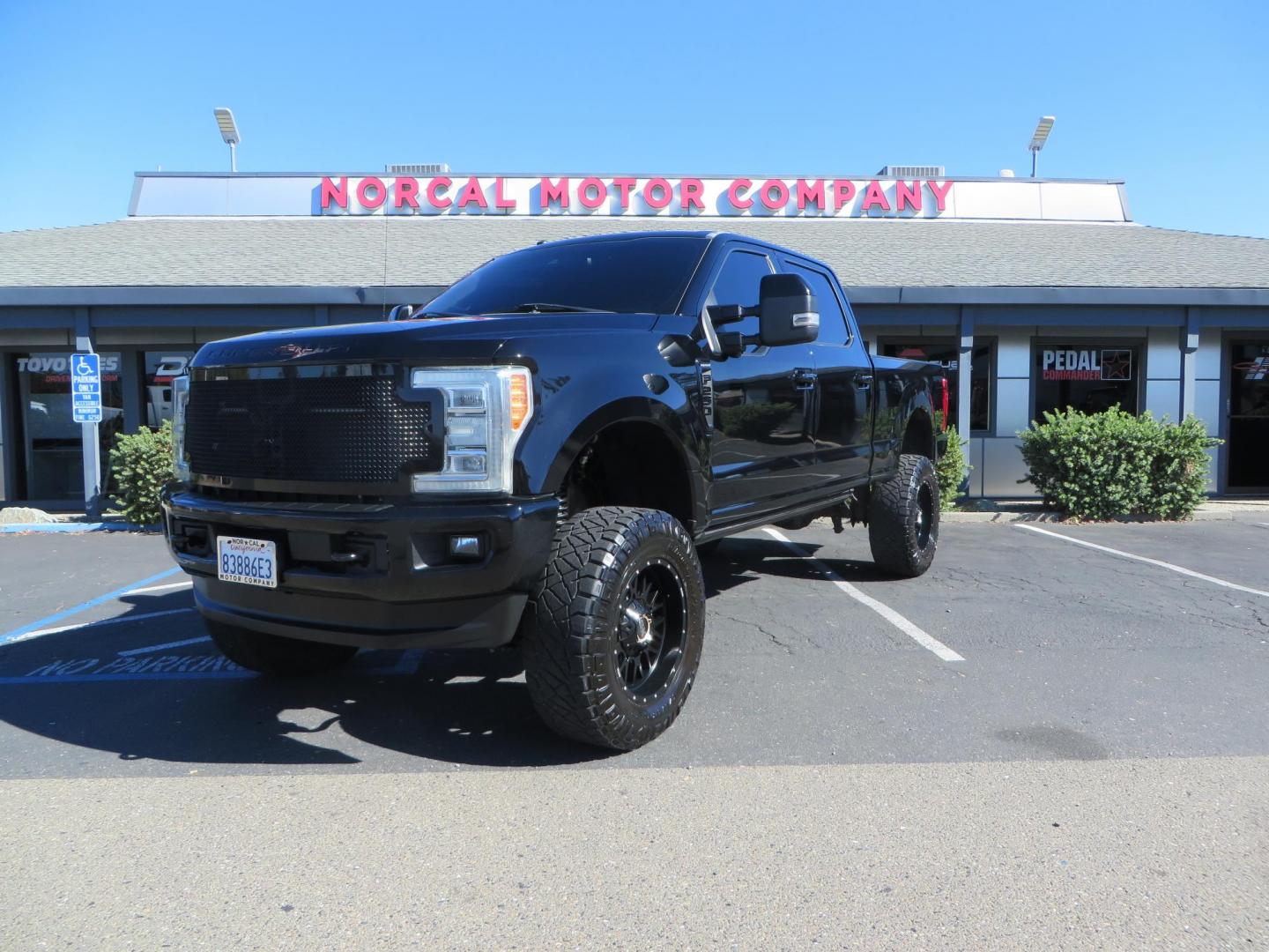 2017 BLACK Ford F-250 SD Platinum Crew Cab Short Bed 4WD (1FT7W2BT0HE) with an 6.7L V8 OHV 16V DIESEL engine, 6A transmission, located at 2630 Grass Valley Highway, Auburn, CA, 95603, (530) 508-5100, 38.937893, -121.095482 - Lifted F-250 featuring a SkyJacker long arm suspension system, Fox 2.5 remote reservoir coilovers, Fox 2.0 rear remote reservoir shocks, Fox dual steering stabilizers, 20" XD wheels, 37" Nitto Ridge Grappler tires, Racer X Mesh Grille, Airlift Air Bags, Painted badges, and window tint. - Photo#0