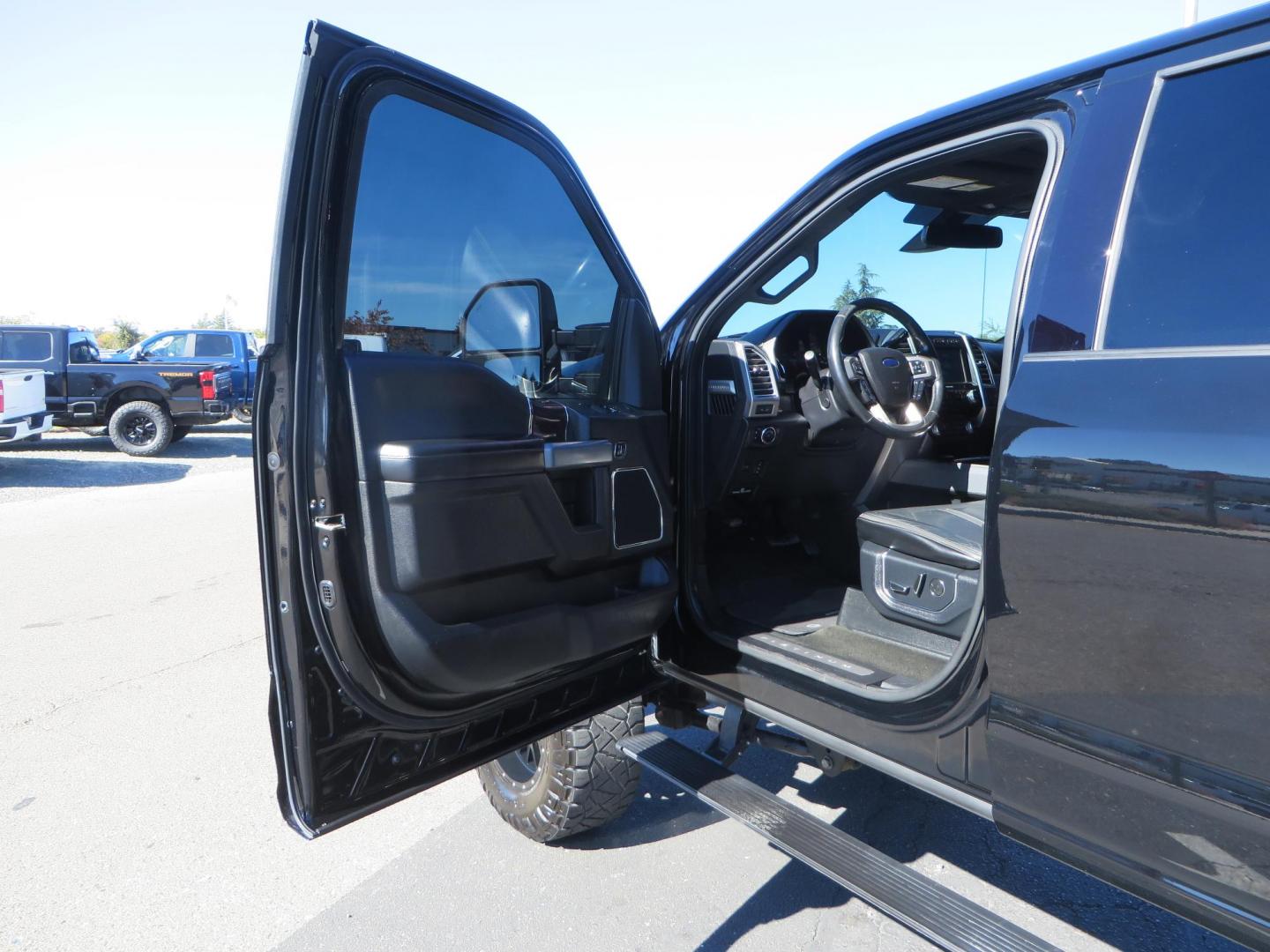 2017 BLACK Ford F-250 SD Platinum Crew Cab Short Bed 4WD (1FT7W2BT0HE) with an 6.7L V8 OHV 16V DIESEL engine, 6A transmission, located at 2630 Grass Valley Highway, Auburn, CA, 95603, (530) 508-5100, 38.937893, -121.095482 - Lifted F-250 featuring a SkyJacker long arm suspension system, Fox 2.5 remote reservoir coilovers, Fox 2.0 rear remote reservoir shocks, Fox dual steering stabilizers, 20" XD wheels, 37" Nitto Ridge Grappler tires, Racer X Mesh Grille, Airlift Air Bags, Painted badges, and window tint. - Photo#24