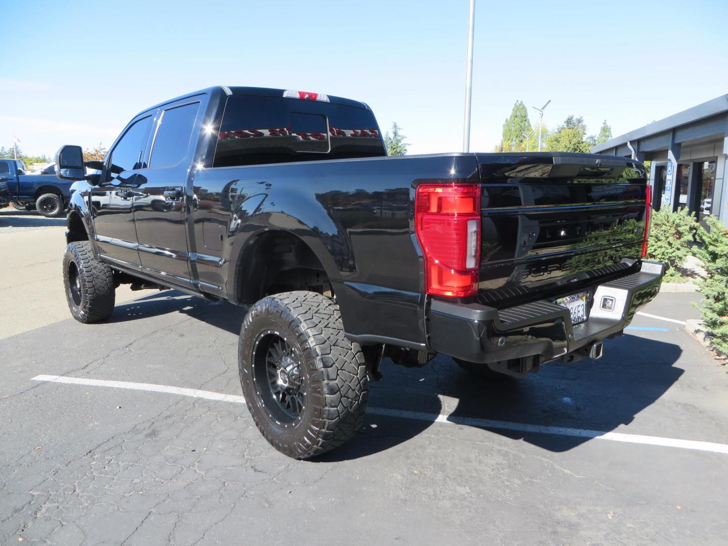 2017 BLACK Ford F-250 SD Platinum Crew Cab Short Bed 4WD (1FT7W2BT0HE) with an 6.7L V8 OHV 16V DIESEL engine, 6A transmission, located at 2630 Grass Valley Highway, Auburn, CA, 95603, (530) 508-5100, 38.937893, -121.095482 - Lifted F-250 featuring a SkyJacker long arm suspension system, Fox 2.5 remote reservoir coilovers, Fox 2.0 rear remote reservoir shocks, Fox dual steering stabilizers, 20" XD wheels, 37" Nitto Ridge Grappler tires, Racer X Mesh Grille, Airlift Air Bags, Painted badges, and window tint. - Photo#6