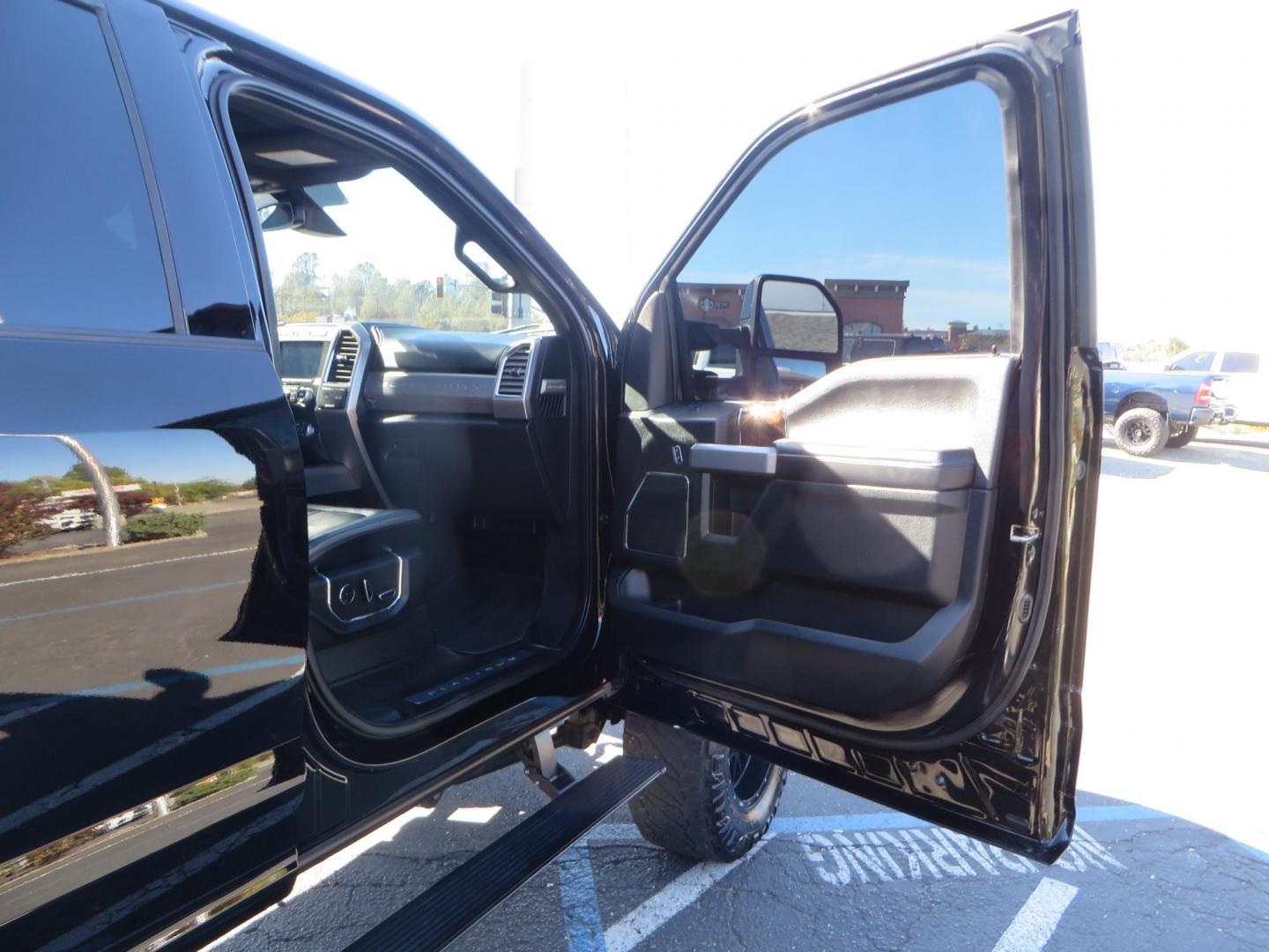 2017 BLACK Ford F-250 SD Platinum Crew Cab Short Bed 4WD (1FT7W2BT0HE) with an 6.7L V8 OHV 16V DIESEL engine, 6A transmission, located at 2630 Grass Valley Highway, Auburn, CA, 95603, (530) 508-5100, 38.937893, -121.095482 - Lifted F-250 featuring a SkyJacker long arm suspension system, Fox 2.5 remote reservoir coilovers, Fox 2.0 rear remote reservoir shocks, Fox dual steering stabilizers, 20" XD wheels, 37" Nitto Ridge Grappler tires, Racer X Mesh Grille, Airlift Air Bags, Painted badges, and window tint. - Photo#60