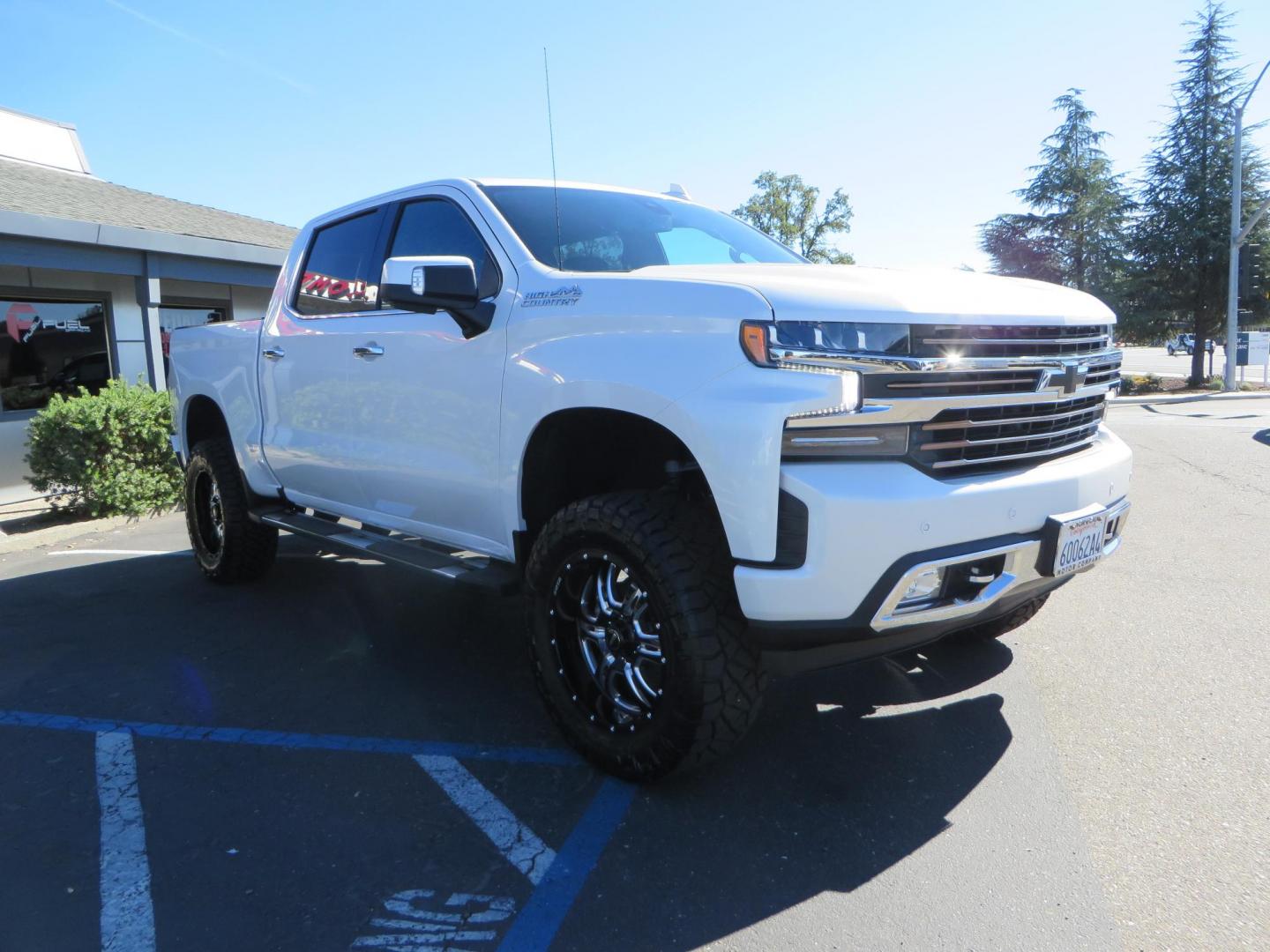 2021 White Chevrolet Silverado 1500 High Country Crew Cab 4WD (3GCUYHEL2MG) with an 6.2L V8 OHV 16V engine, 6A transmission, located at 2630 Grass Valley Highway, Auburn, CA, 95603, (530) 508-5100, 38.937893, -121.095482 - Features - Zone Offroad 6" lift kit, 35" Nitto Ridge Grappler tires, 20" SOTA wheels, and a Bakflip MX4 bedcover. - Photo#2