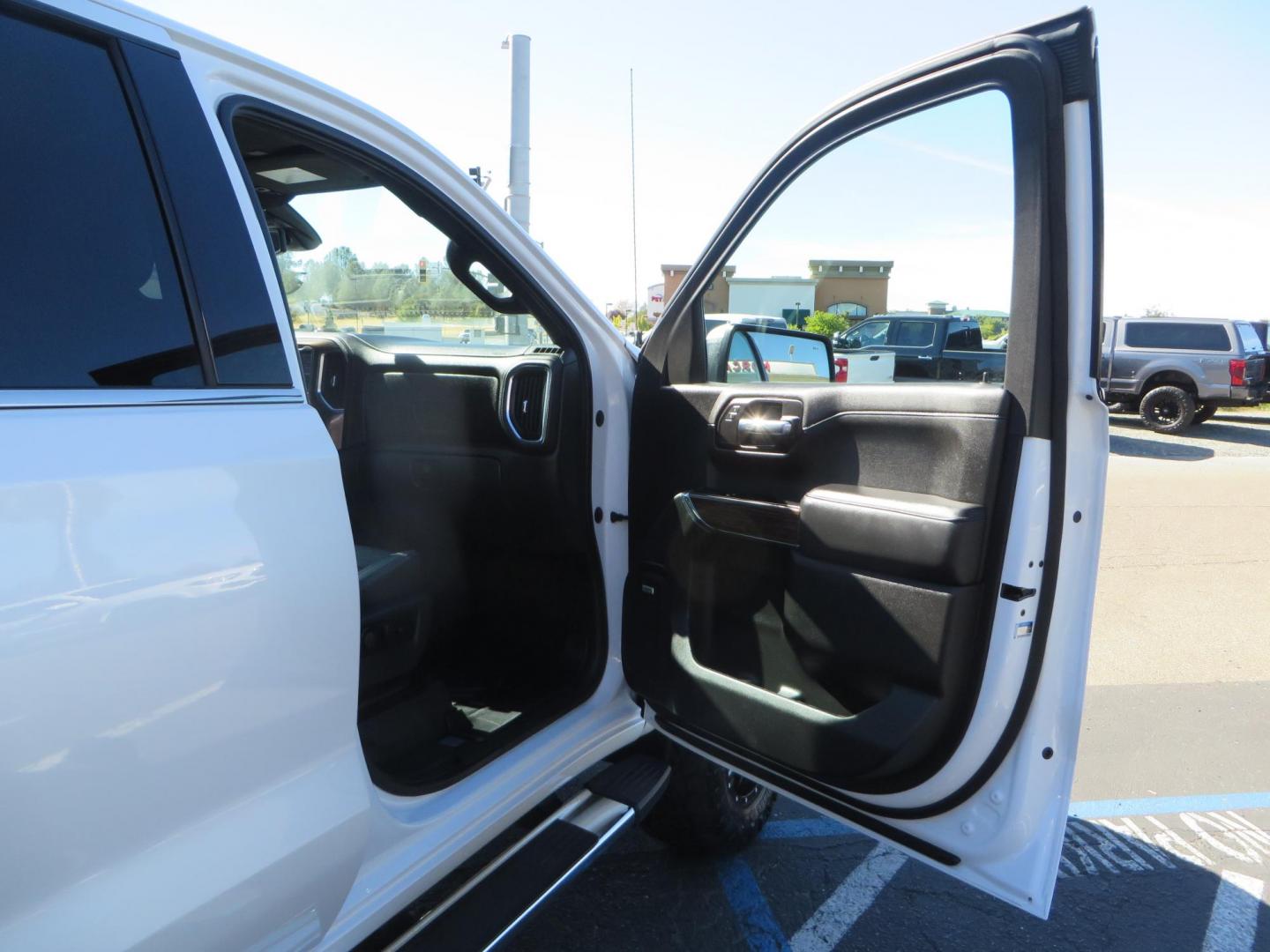 2021 White Chevrolet Silverado 1500 High Country Crew Cab 4WD (3GCUYHEL2MG) with an 6.2L V8 OHV 16V engine, 6A transmission, located at 2630 Grass Valley Highway, Auburn, CA, 95603, (530) 508-5100, 38.937893, -121.095482 - Features - Zone Offroad 6" lift kit, 35" Nitto Ridge Grappler tires, 20" SOTA wheels, and a Bakflip MX4 bedcover. - Photo#53