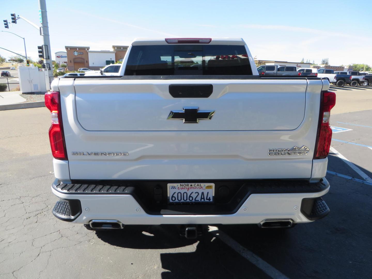 2021 White Chevrolet Silverado 1500 High Country Crew Cab 4WD (3GCUYHEL2MG) with an 6.2L V8 OHV 16V engine, 6A transmission, located at 2630 Grass Valley Highway, Auburn, CA, 95603, (530) 508-5100, 38.937893, -121.095482 - Features - Zone Offroad 6" lift kit, 35" Nitto Ridge Grappler tires, 20" SOTA wheels, and a Bakflip MX4 bedcover. - Photo#6