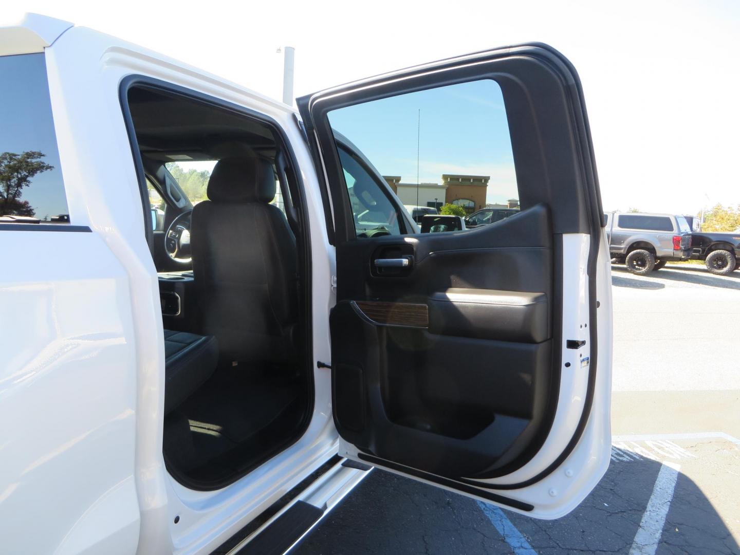 2021 White Chevrolet Silverado 1500 High Country Crew Cab 4WD (3GCUYHEL2MG) with an 6.2L V8 OHV 16V engine, 6A transmission, located at 2630 Grass Valley Highway, Auburn, CA, 95603, (530) 508-5100, 38.937893, -121.095482 - Features - Zone Offroad 6" lift kit, 35" Nitto Ridge Grappler tires, 20" SOTA wheels, and a Bakflip MX4 bedcover. - Photo#60