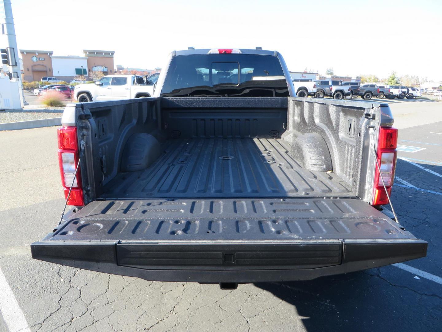 2021 Charcoal Ford F-350 SD Lariat Crew Cab Long Bed DRW 4WD (1FT8W3DT7ME) with an 6.7L V8 OHV 16V DIESEL engine, 6A transmission, located at 2630 Grass Valley Highway, Auburn, CA, 95603, (530) 508-5100, 38.937893, -121.095482 - Tow Rig sitting on a set of 20" DDC The Hole wheels and Toyo RT trail tires. - Photo#16