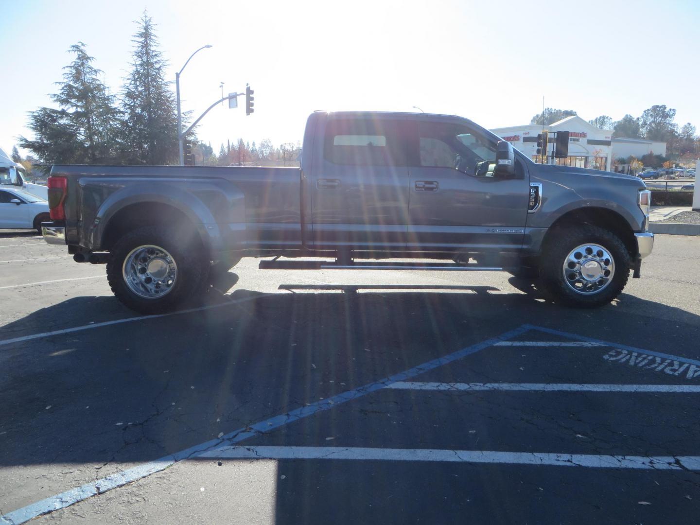 2021 Charcoal Ford F-350 SD Lariat Crew Cab Long Bed DRW 4WD (1FT8W3DT7ME) with an 6.7L V8 OHV 16V DIESEL engine, 6A transmission, located at 2630 Grass Valley Highway, Auburn, CA, 95603, (530) 508-5100, 38.937893, -121.095482 - Tow Rig sitting on a set of 20" DDC The Hole wheels and Toyo RT trail tires. - Photo#3