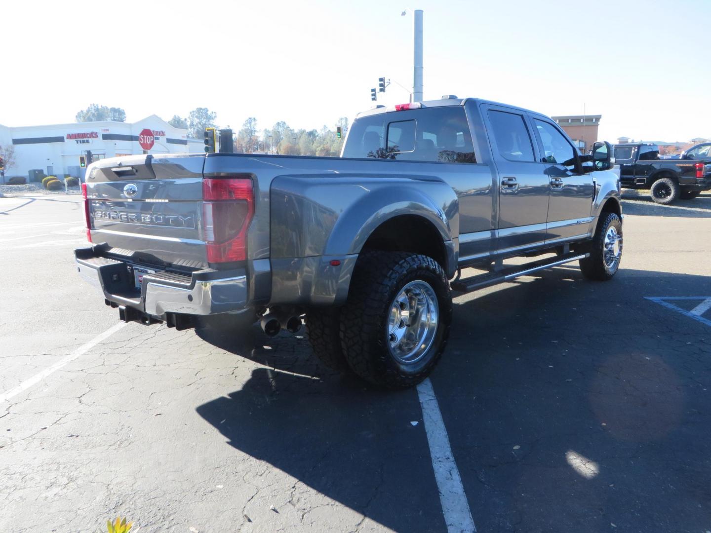 2021 Charcoal Ford F-350 SD Lariat Crew Cab Long Bed DRW 4WD (1FT8W3DT7ME) with an 6.7L V8 OHV 16V DIESEL engine, 6A transmission, located at 2630 Grass Valley Highway, Auburn, CA, 95603, (530) 508-5100, 38.937893, -121.095482 - Tow Rig sitting on a set of 20" DDC The Hole wheels and Toyo RT trail tires. - Photo#4