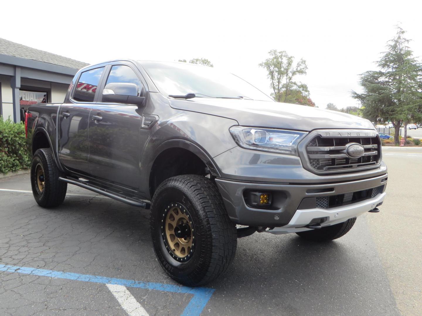 2019 Charcoal Ford Ranger Lariat SuperCrew 4WD (1FTER4FH8KL) with an 2.3L L4 DOHC 16V engine, 10A transmission, located at 2630 Grass Valley Highway, Auburn, CA, 95603, (530) 508-5100, 38.937893, -121.095482 - Features, King 2.5 remote reservoir coilovers, King 2.5 piggyback shocks, Camburg upper control arms, Method Race wheels, Lexani Terrain Beast tires, Baja Designs fog lights, Rock Sliders, Windiw tint, and an ARB air compressor. - Photo#2