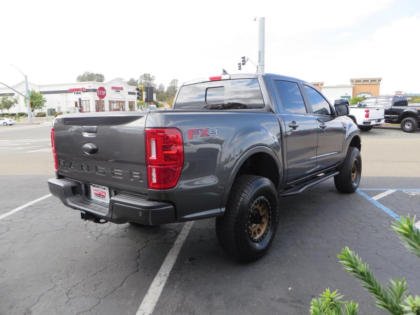 2019 Charcoal Ford Ranger Lariat SuperCrew 4WD (1FTER4FH8KL) with an 2.3L L4 DOHC 16V engine, 10A transmission, located at 2630 Grass Valley Highway, Auburn, CA, 95603, (530) 508-5100, 38.937893, -121.095482 - Features, King 2.5 remote reservoir coilovers, King 2.5 piggyback shocks, Camburg upper control arms, Method Race wheels, Lexani Terrain Beast tires, Baja Designs fog lights, Rock Sliders, Windiw tint, and an ARB air compressor. - Photo#4