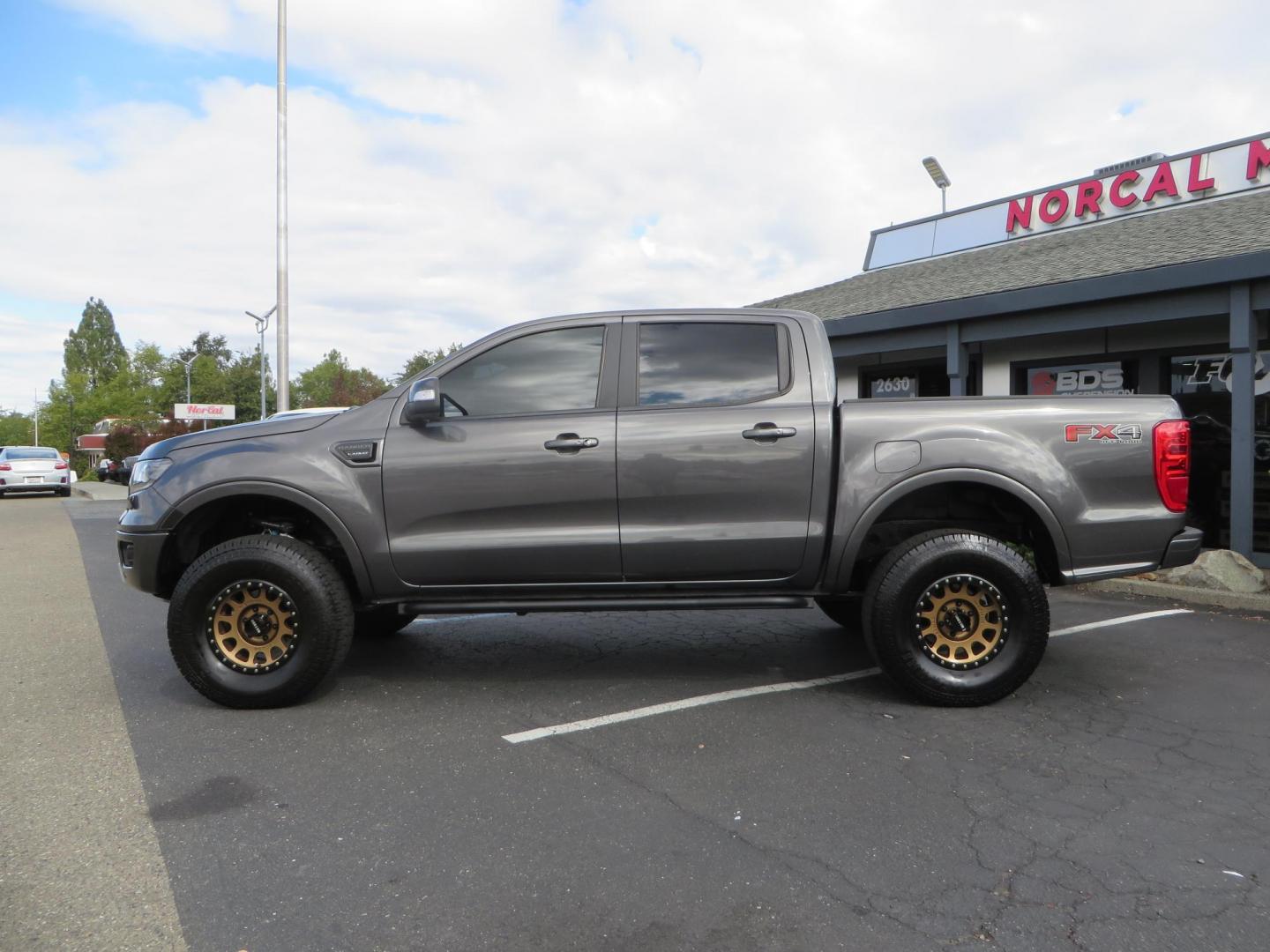 2019 Charcoal Ford Ranger Lariat SuperCrew 4WD (1FTER4FH8KL) with an 2.3L L4 DOHC 16V engine, 10A transmission, located at 2630 Grass Valley Highway, Auburn, CA, 95603, (530) 508-5100, 38.937893, -121.095482 - Features, King 2.5 remote reservoir coilovers, King 2.5 piggyback shocks, Camburg upper control arms, Method Race wheels, Lexani Terrain Beast tires, Baja Designs fog lights, Rock Sliders, Windiw tint, and an ARB air compressor. - Photo#7