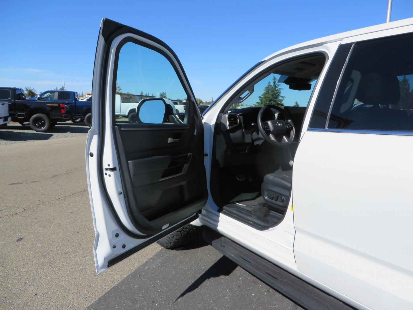 2022 White Toyota Tundra Limited CrewMax 2WD (5TFJA5AB0NX) with an 3.5L V6 DOHC 24V engine, 6A transmission, located at 2630 Grass Valley Highway, Auburn, CA, 95603, (530) 508-5100, 38.937893, -121.095482 - Tundra featuring a 2" leveling kit, 35" Nitto Ridge Grappler tires, 18" KMC IMS wheels, Retrax tonneau cover, and Yakima truck bed ladder rack. - Photo#21