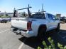 2022 White Toyota Tundra Limited CrewMax 2WD (5TFJA5AB0NX) with an 3.5L V6 DOHC 24V engine, 6A transmission, located at 2630 Grass Valley Highway, Auburn, CA, 95603, (530) 508-5100, 38.937893, -121.095482 - Tundra featuring a 2" leveling kit, 35" Nitto Ridge Grappler tires, 18" KMC IMS wheels, Retrax tonneau cover, and Yakima truck bed ladder rack. - Photo#4