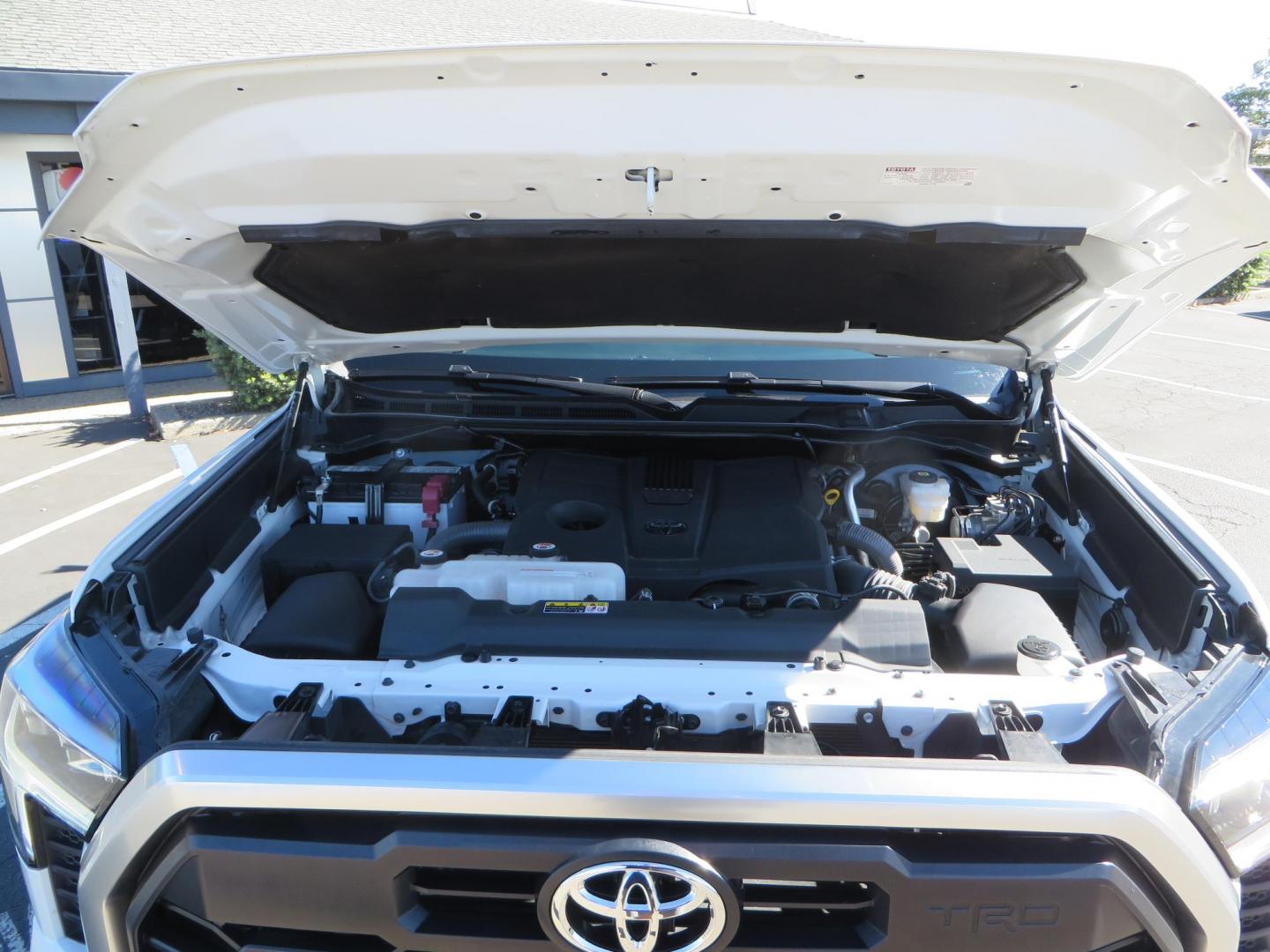 2022 White Toyota Tundra Limited CrewMax 2WD (5TFJA5AB0NX) with an 3.5L V6 DOHC 24V engine, 6A transmission, located at 2630 Grass Valley Highway, Auburn, CA, 95603, (530) 508-5100, 38.937893, -121.095482 - Tundra featuring a 2" leveling kit, 35" Nitto Ridge Grappler tires, 18" KMC IMS wheels, Retrax tonneau cover, and Yakima truck bed ladder rack. - Photo#62