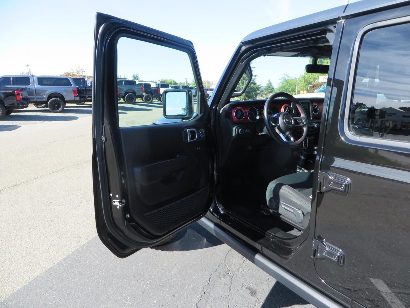 2020 BLACK /BLACK Jeep Wrangler Unlimited Rubicon (1C4HJXFGXLW) with an 3.6L V6 DOHC 24V FFV engine, 6A transmission, located at 2630 Grass Valley Highway, Auburn, CA, 95603, (530) 508-5100, 38.937893, -121.095482 - Rubicon with a set of brand new 392 wheels and tires as well as a new factory soft top never installed. - Photo#16