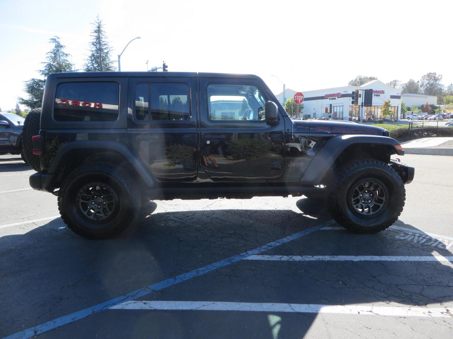 2020 BLACK /BLACK Jeep Wrangler Unlimited Rubicon (1C4HJXFGXLW) with an 3.6L V6 DOHC 24V FFV engine, 6A transmission, located at 2630 Grass Valley Highway, Auburn, CA, 95603, (530) 508-5100, 38.937893, -121.095482 - Rubicon with a set of brand new 392 wheels and tires as well as a new factory soft top never installed. - Photo#3